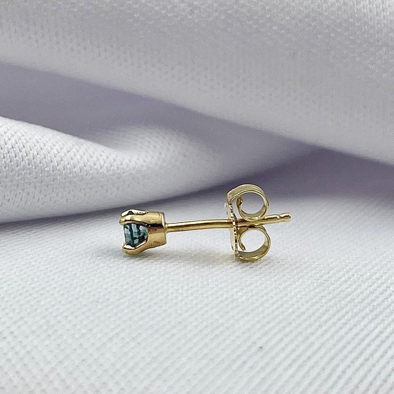 side view white background .28ctw Treated Blue Diamond Stud Earrings 14k Yellow Gold
