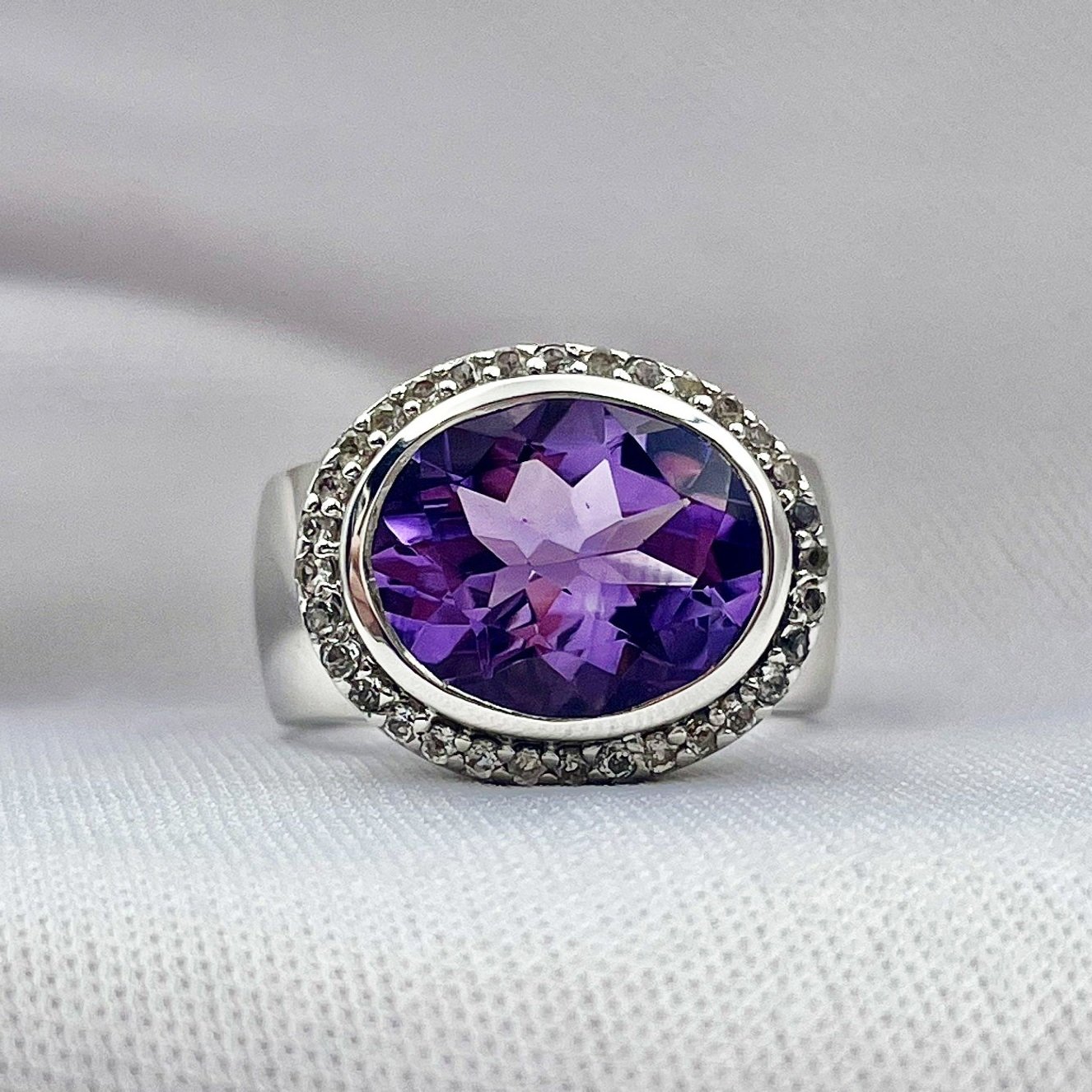 close up white background 925 Silver Oval Amethyst With White Topaz Halo Ladies Ring
