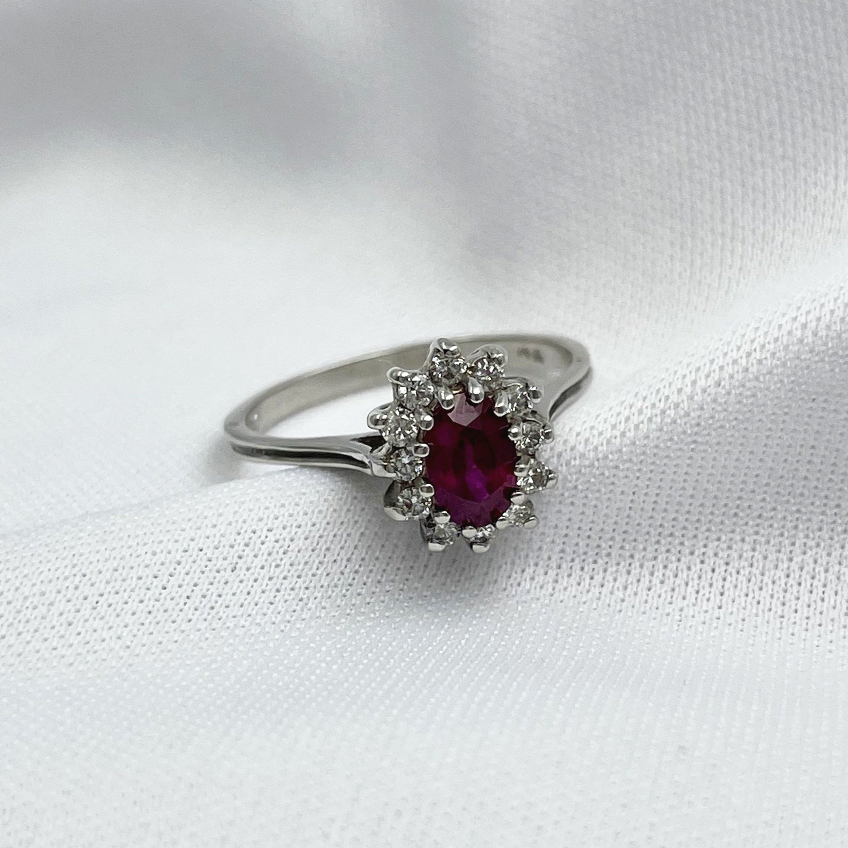 3/4 side view white background 1/2ct Ruby Oval With Diamond Halo 14k White Gold Ladies Ring