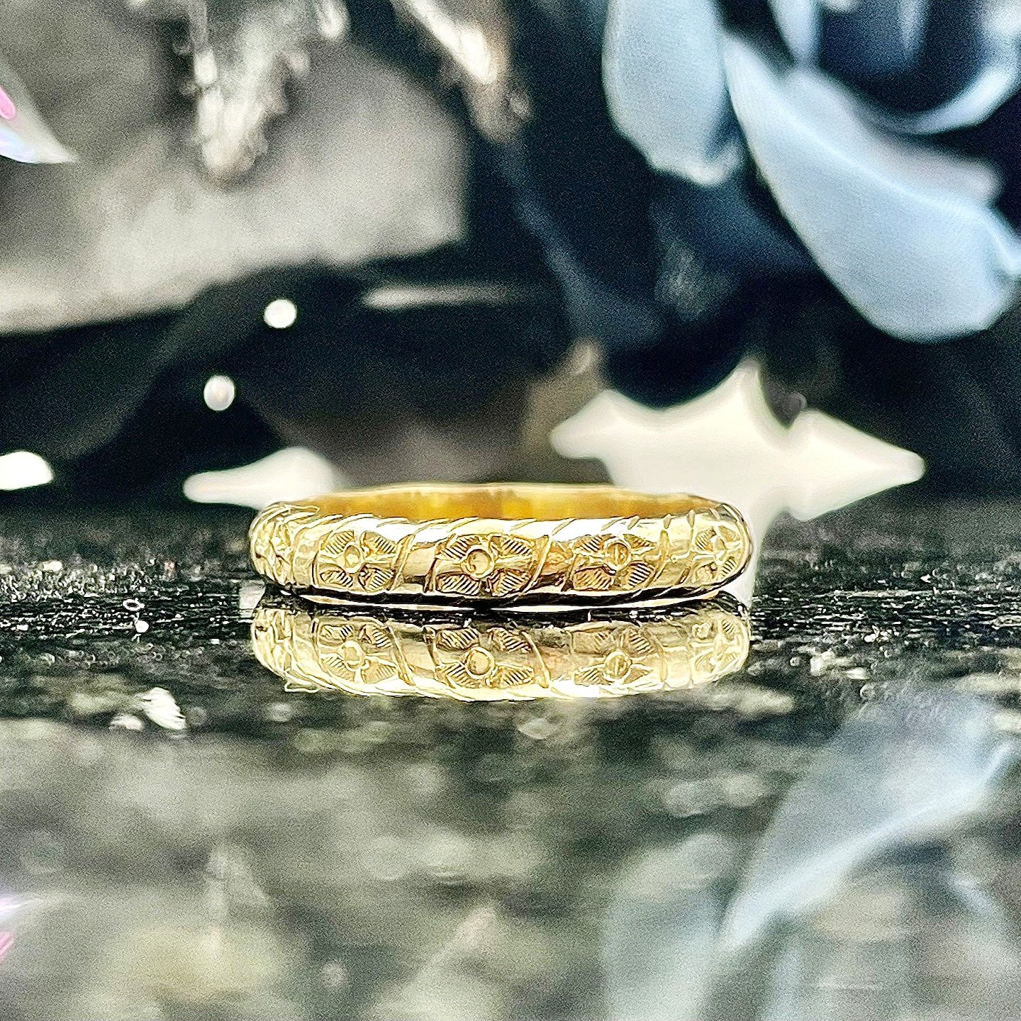 close up in front of flowers Men's Carved Estate Wedding Band 14k Yellow Gold