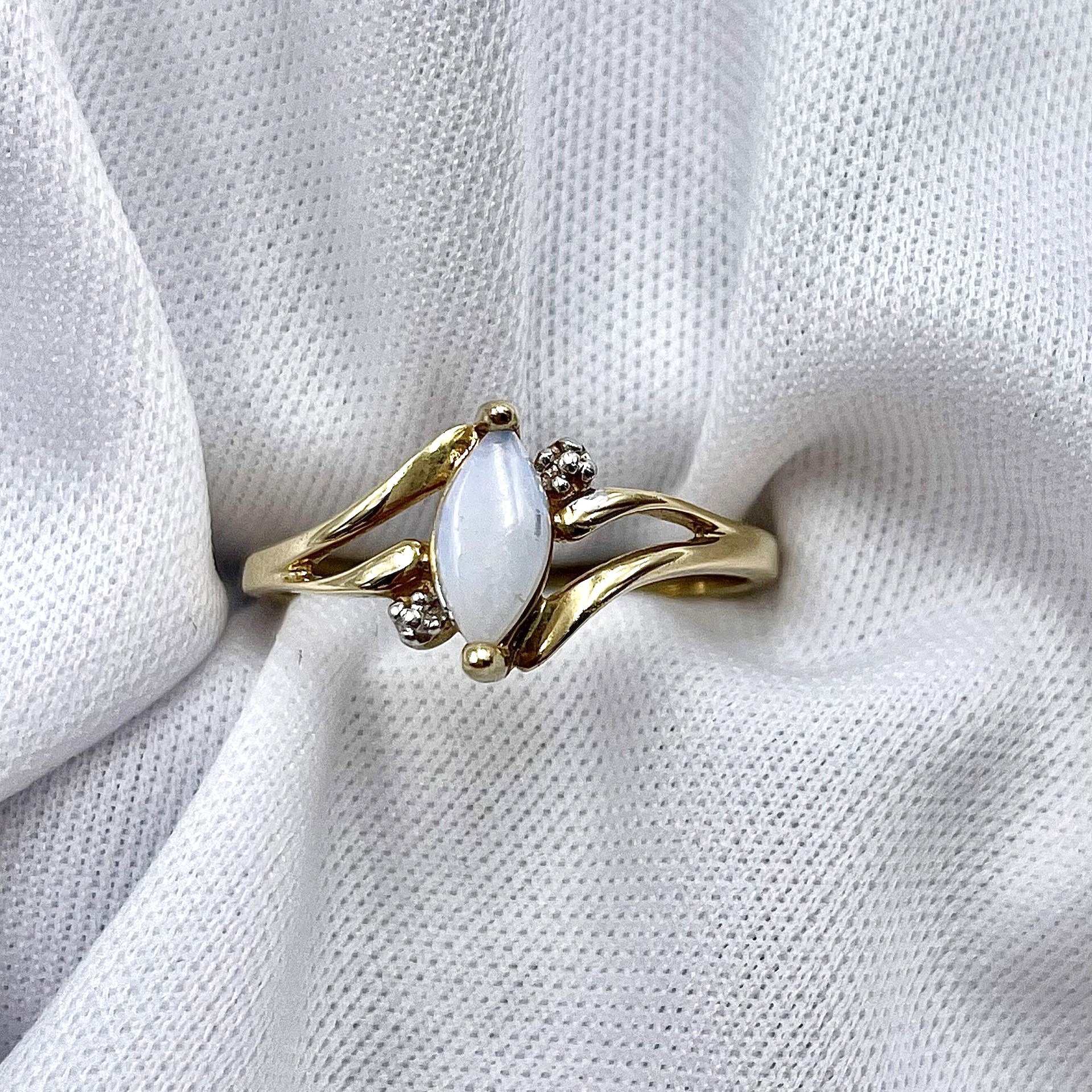 top down white background 10k Yellow Gold Marquise Opal With 10k White Gold Faux Accents Ladies Ring