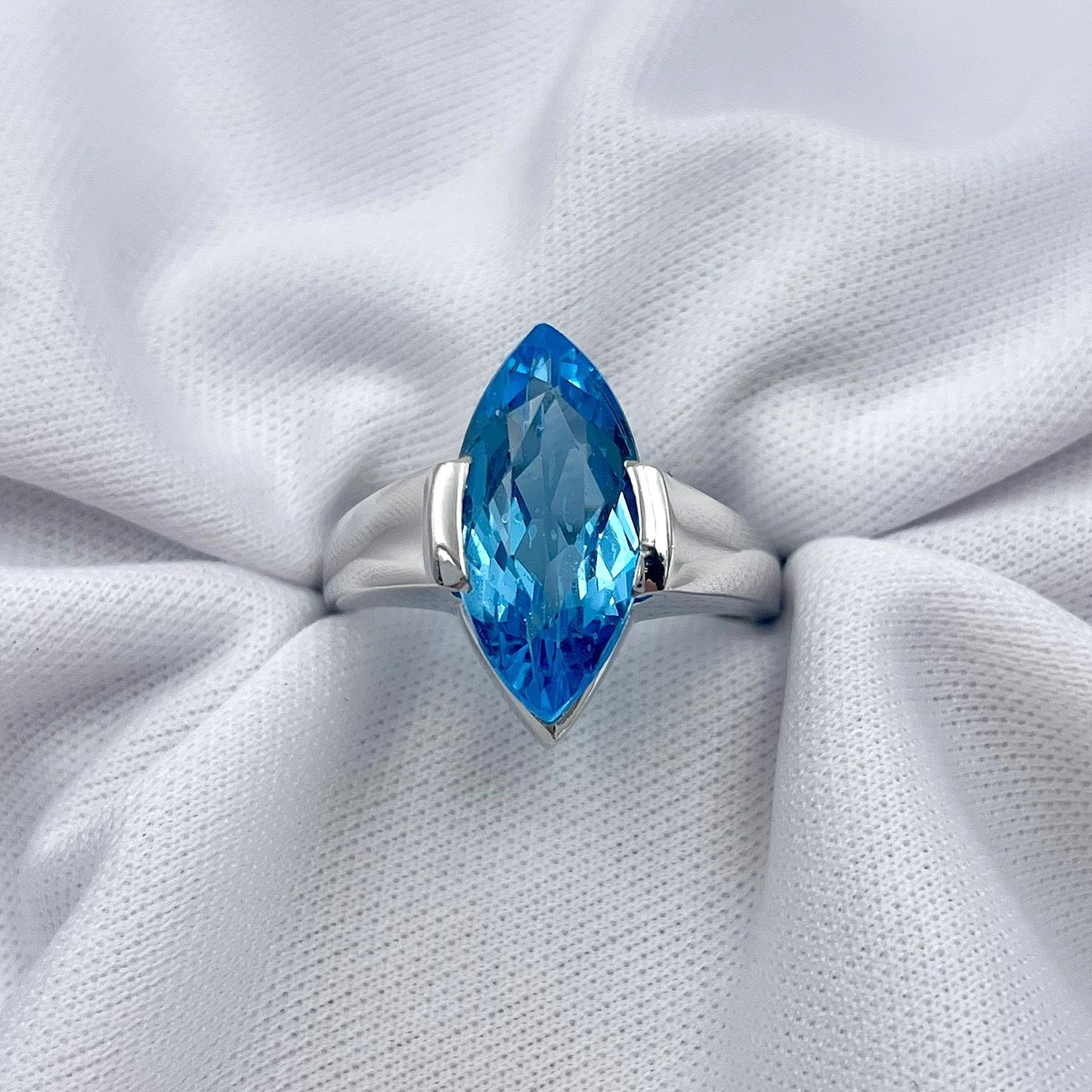 top down view white background Marquise Cut Blue Topaz Solitaire Ladies Ring 14k white gold