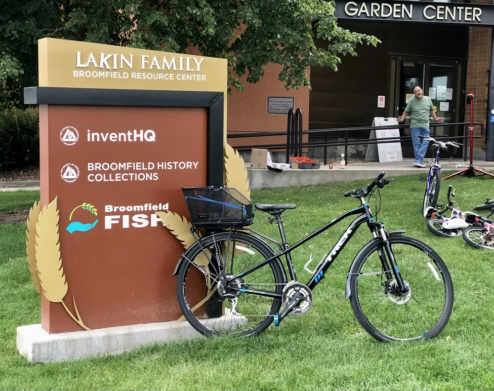Community members receiving bikes at the Ride Broomfield giveaway