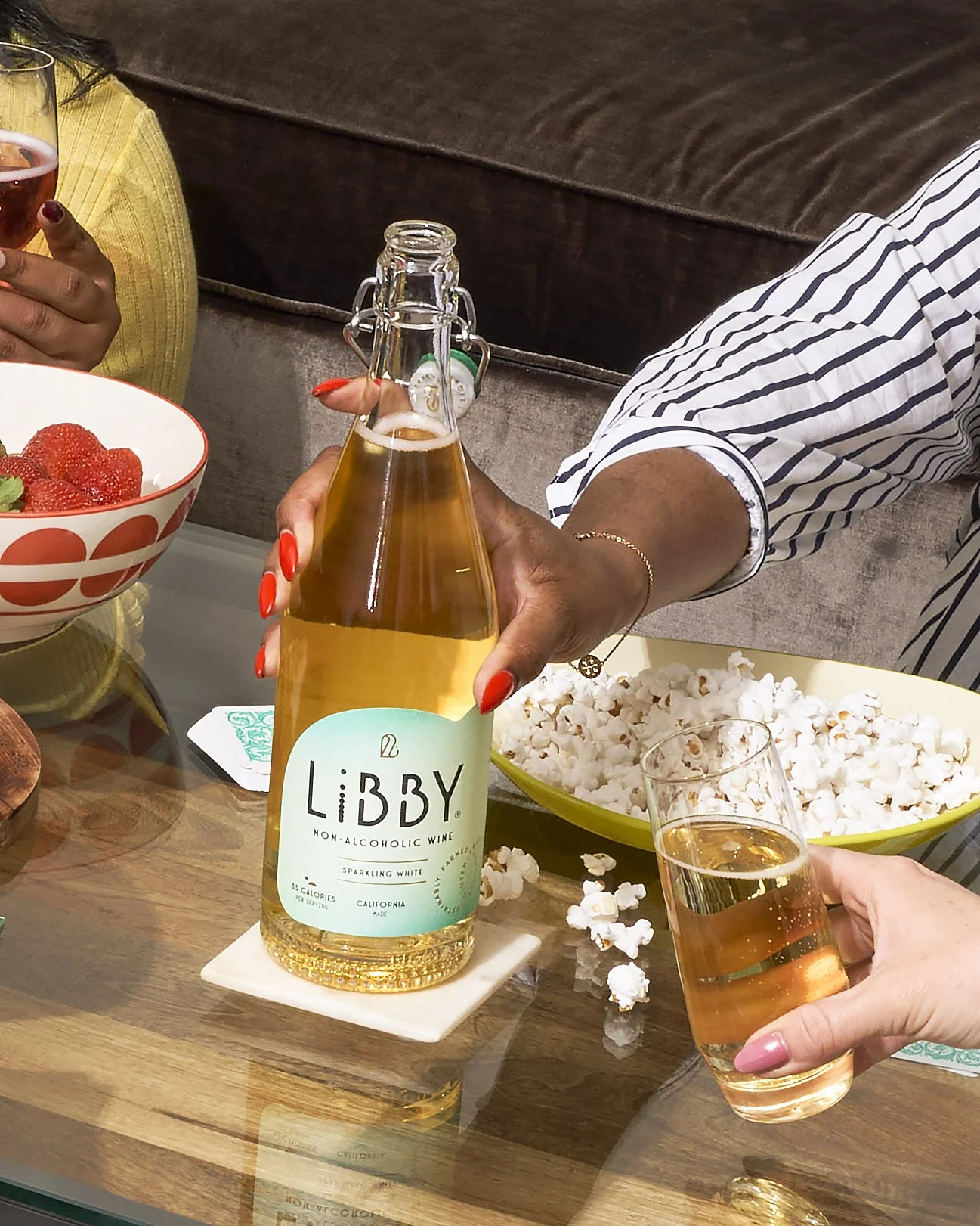 LiBBY non-alcoholic wine bottles on table with appetizers and entertaining setup, lifestyle beverage photography by Golden Joy Photography in Los Angeles