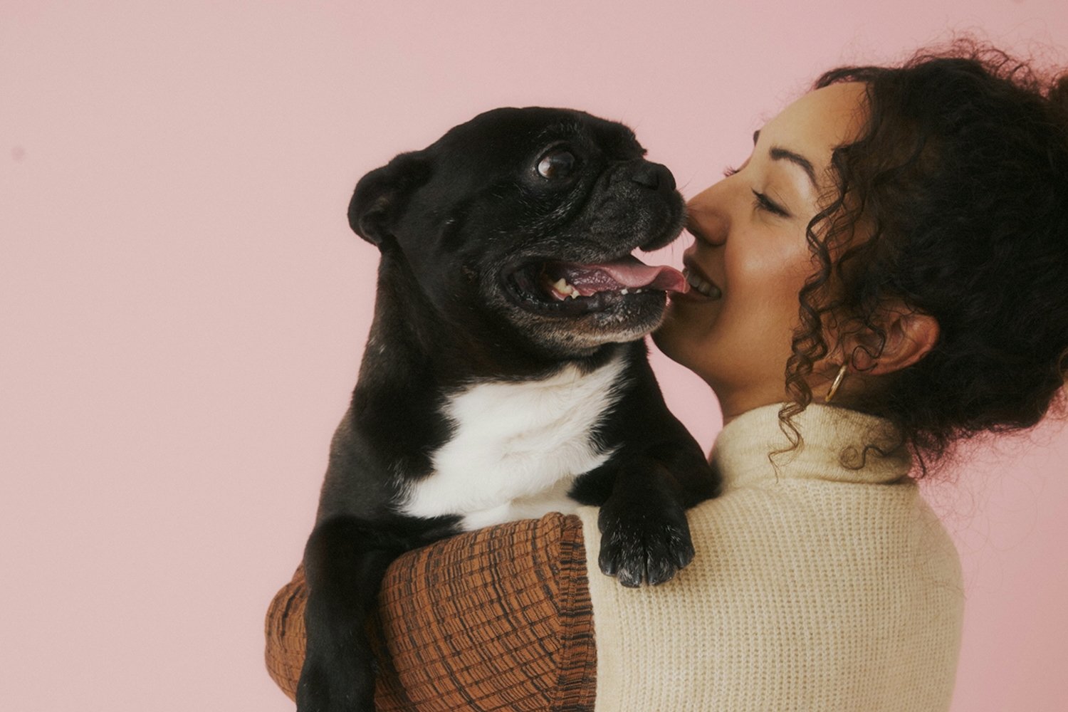 A woman holding a dog