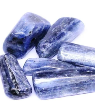Our Childhood Daydream Soy Candle includes Kyanite Gemstones inside and out