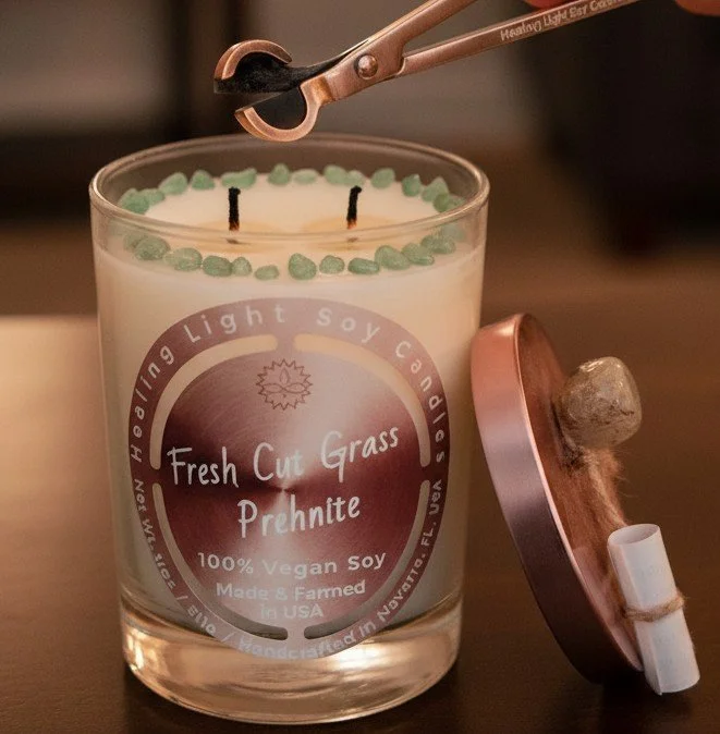 wick trimmer and a candle that was lit.jpg