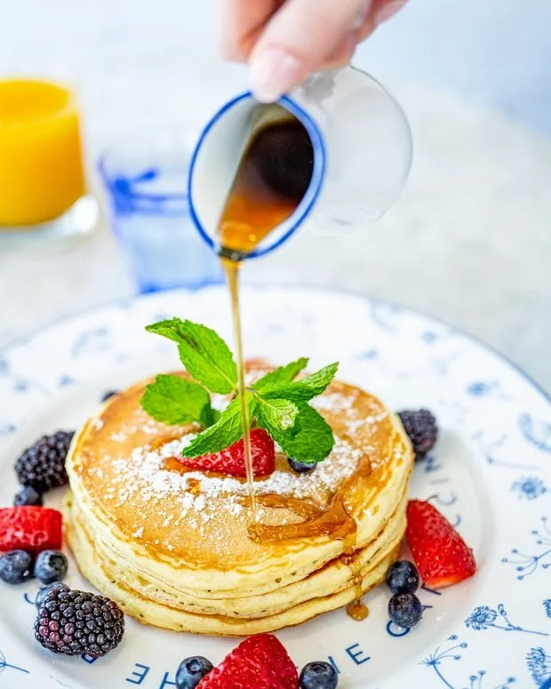 Buttermilk pancakes with seasonal berries and maple syrup