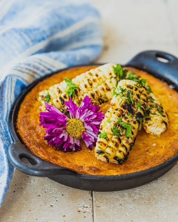 Skillet baked homestyle cornbread with butter and honey