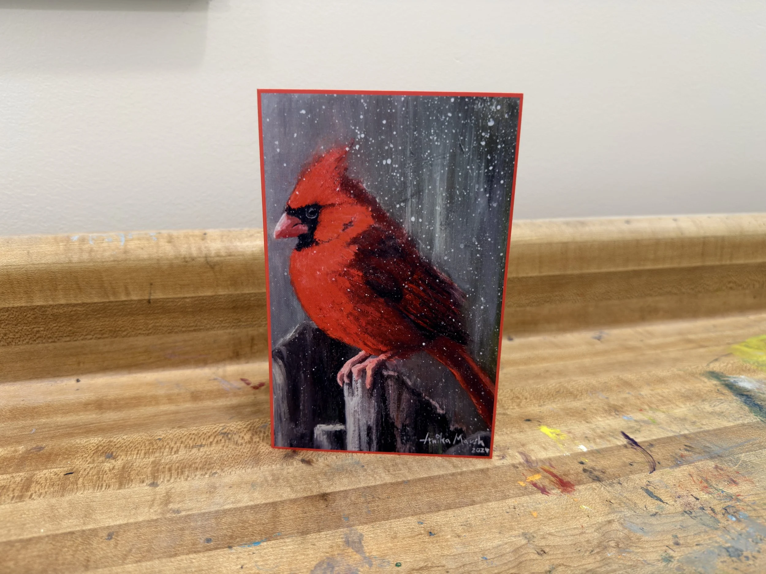 'Crimson Solitude in Winter's Embrace' Greeting Card