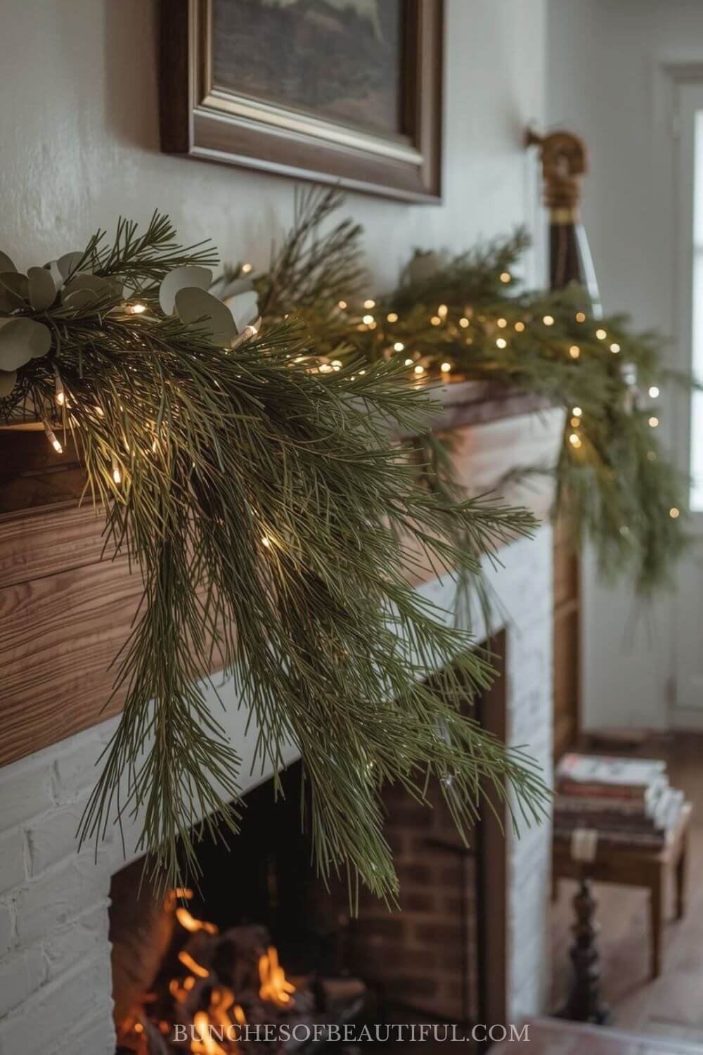 Vintage Christmas inspired mantle with pine and eucalyptus
