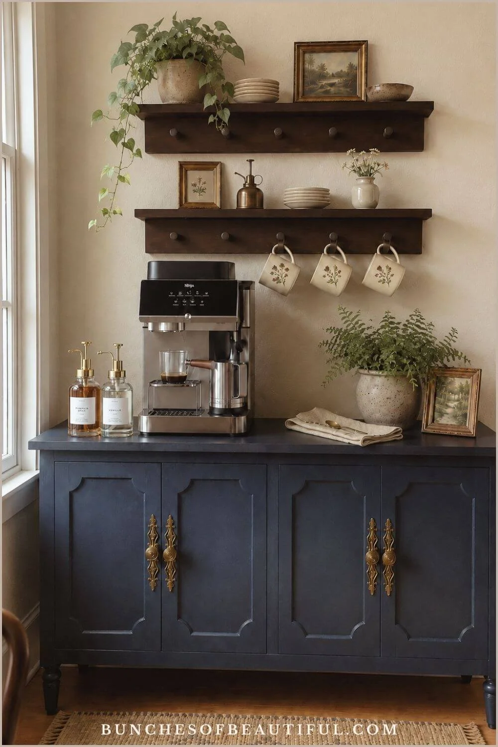 Blue vintage sideboard styled as a coffee station with an espresso machine, wood peg shelves, hanging floral mugs, syrup bottles, plates, and plants.