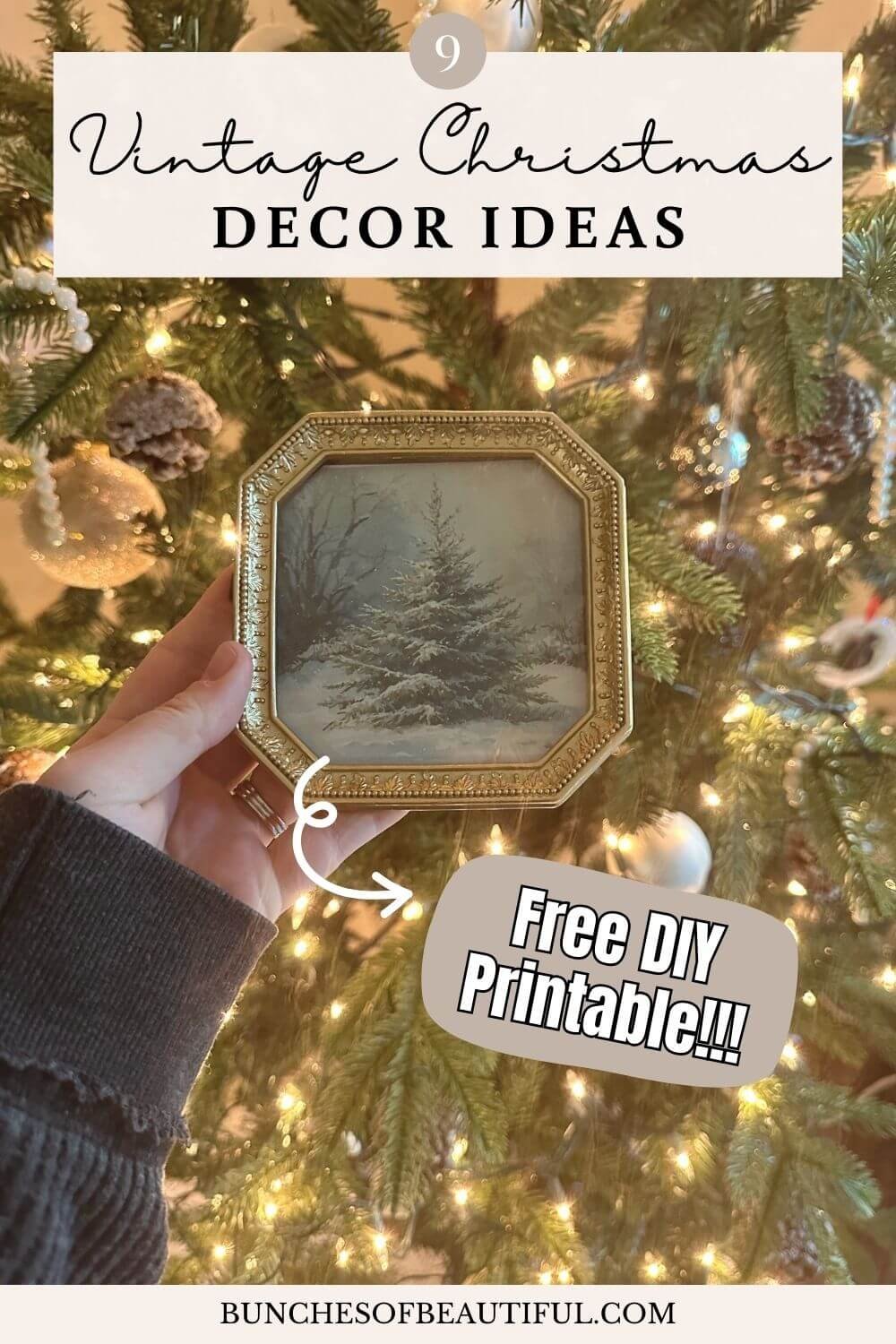 Vintage Christmas decor featuring a framed winter tree illustration held in front of a Christmas tree with warm white lights and ornaments.