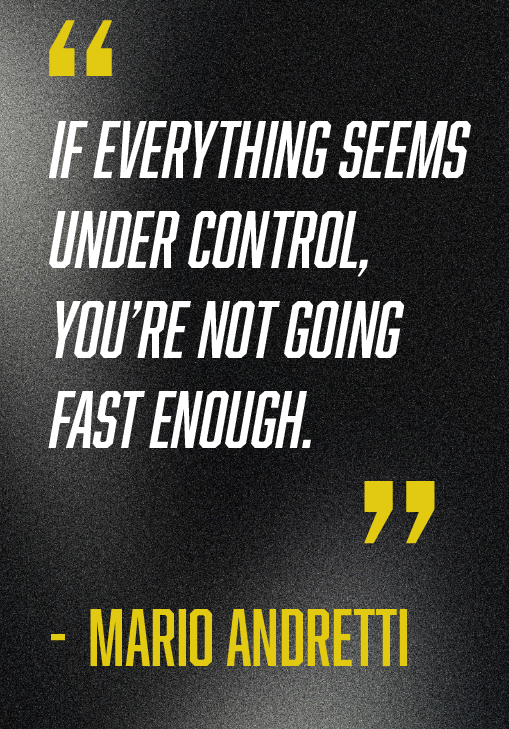 A motivational quote by Mario Andretti that reads, 'If everything seems under control, you're not going fast enough,' on a black background with yellow quotation marks and yellow attribution.