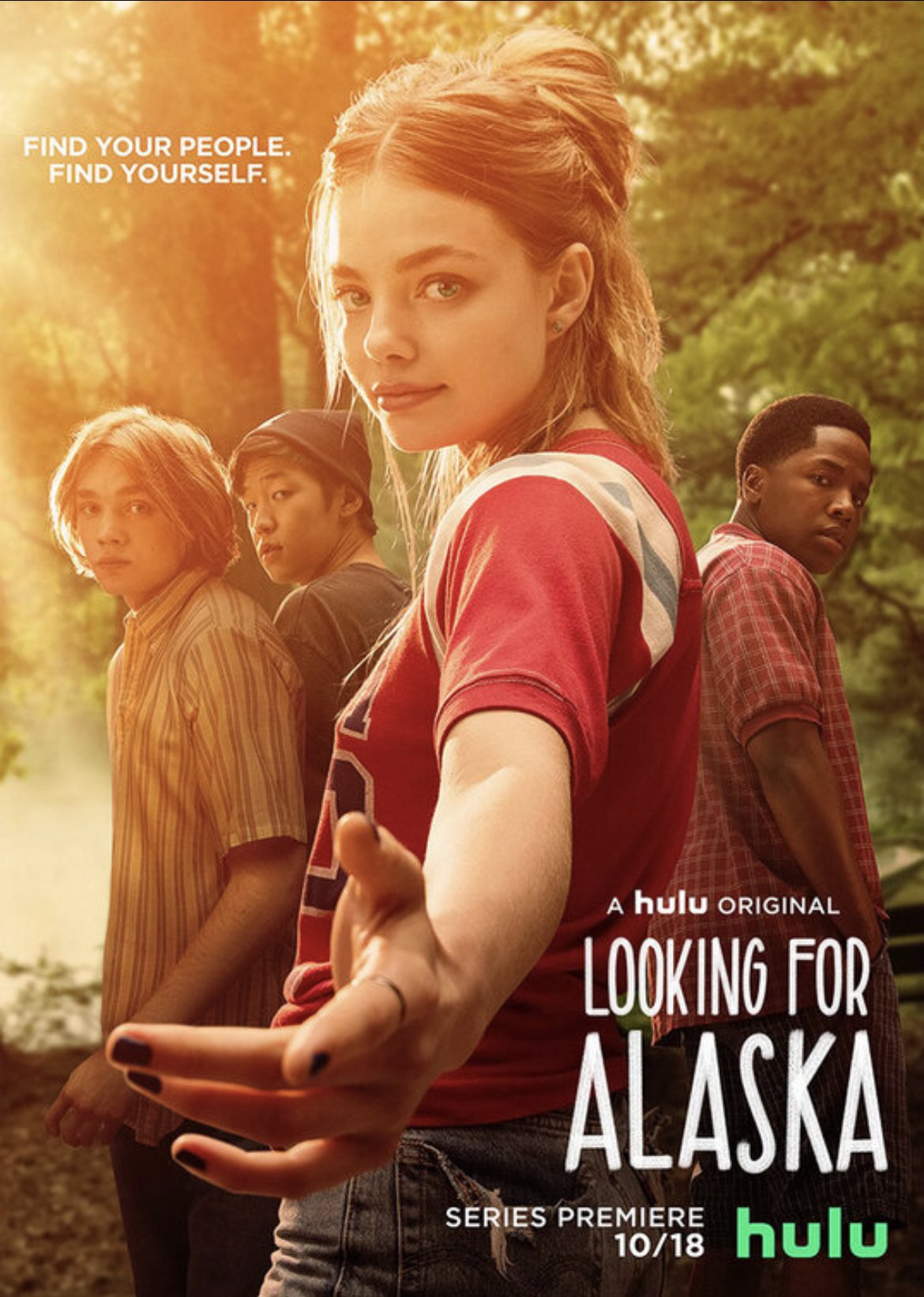Poster for the Hulu original series 'Looking for Alaska,' showing four young characters standing outdoors in a forested area during sunset, with the series premiere date of October 18.