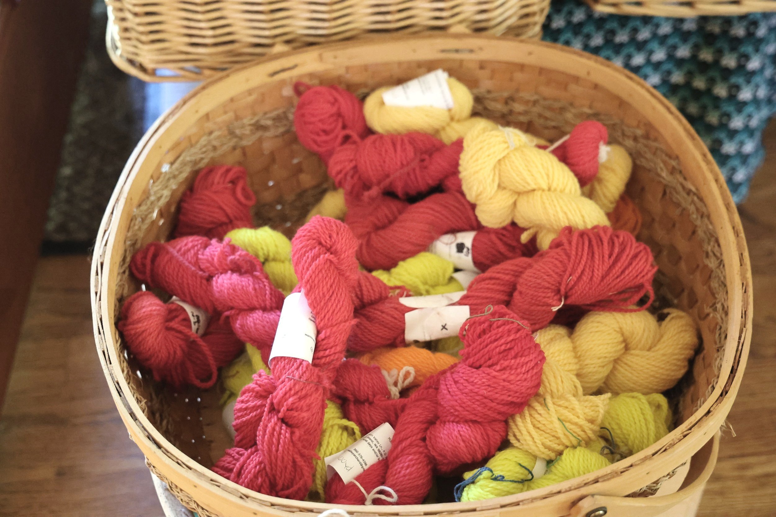 a basket of red and yellow yarn