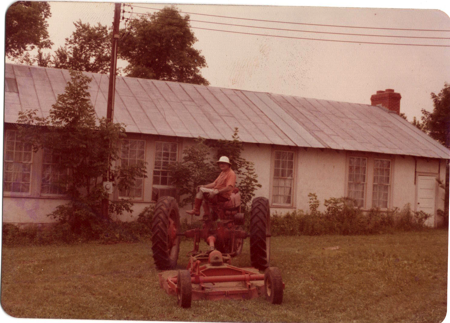 Bill Carrigan on his tractor, (approximately 1970s).