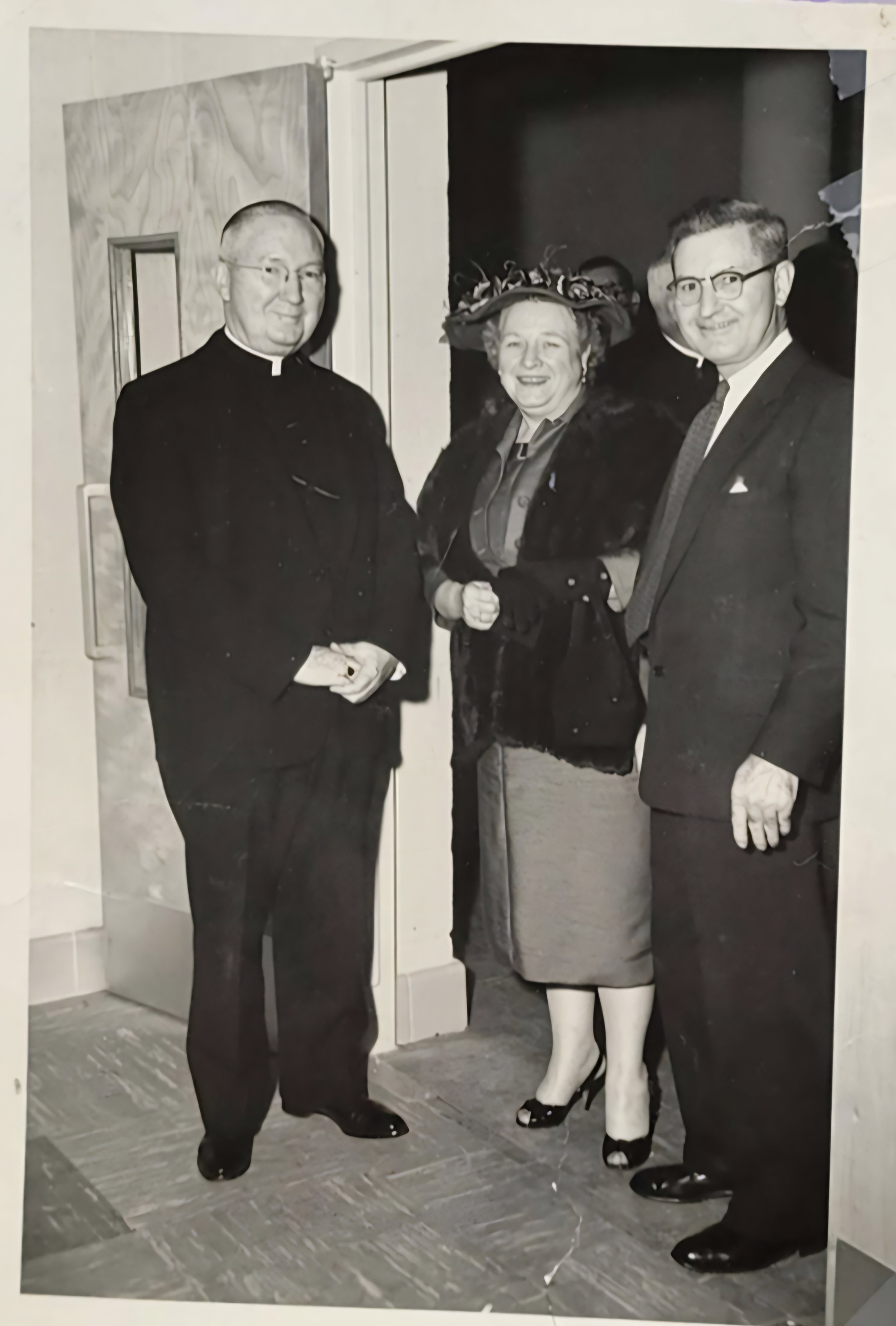 William and Ramona Carrigan with the pastor of Holy Family Church in Maryland (Between 1952-1957).
