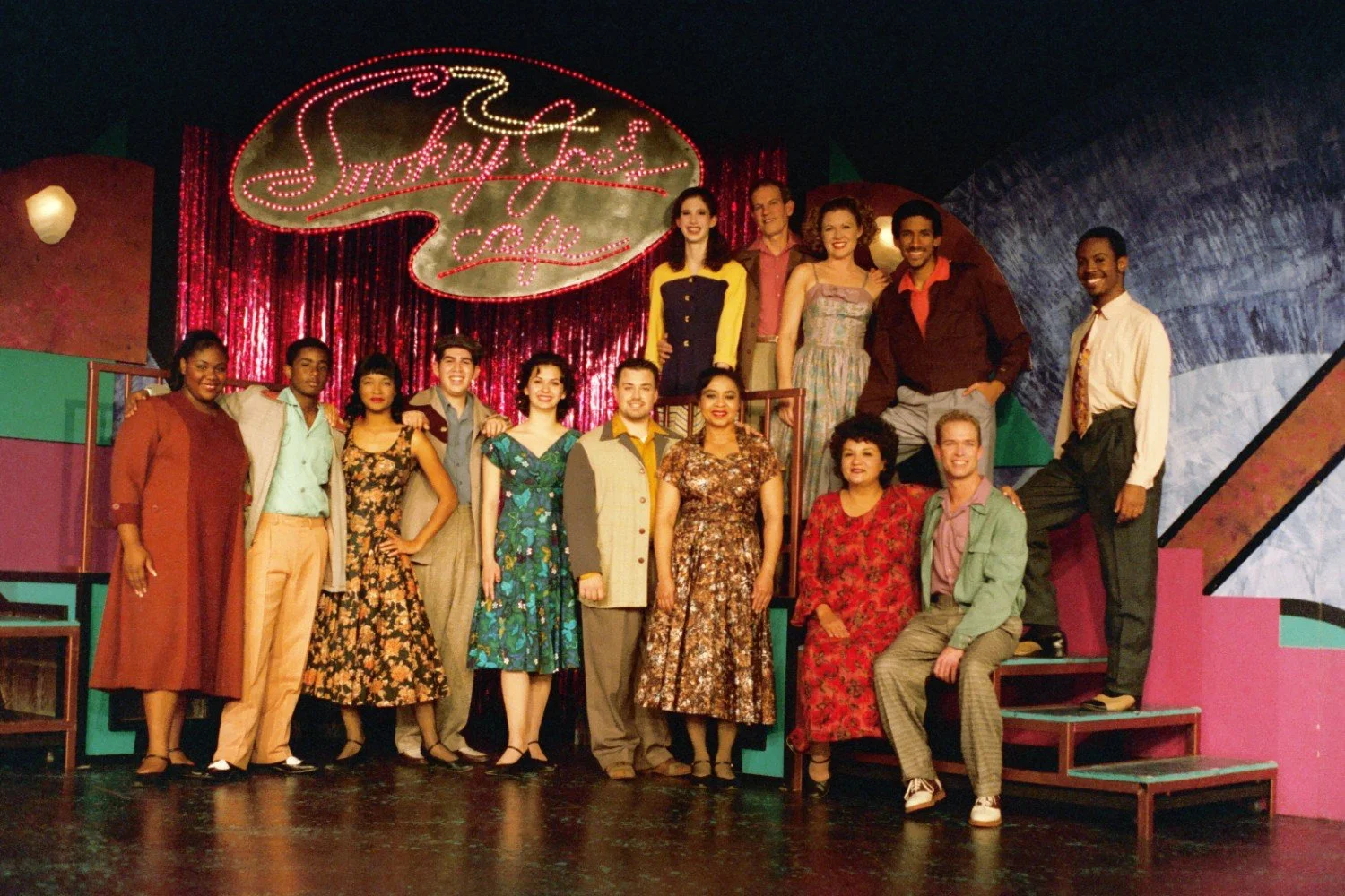 Group of people on stage at "Smokey Joe's Cafe" set