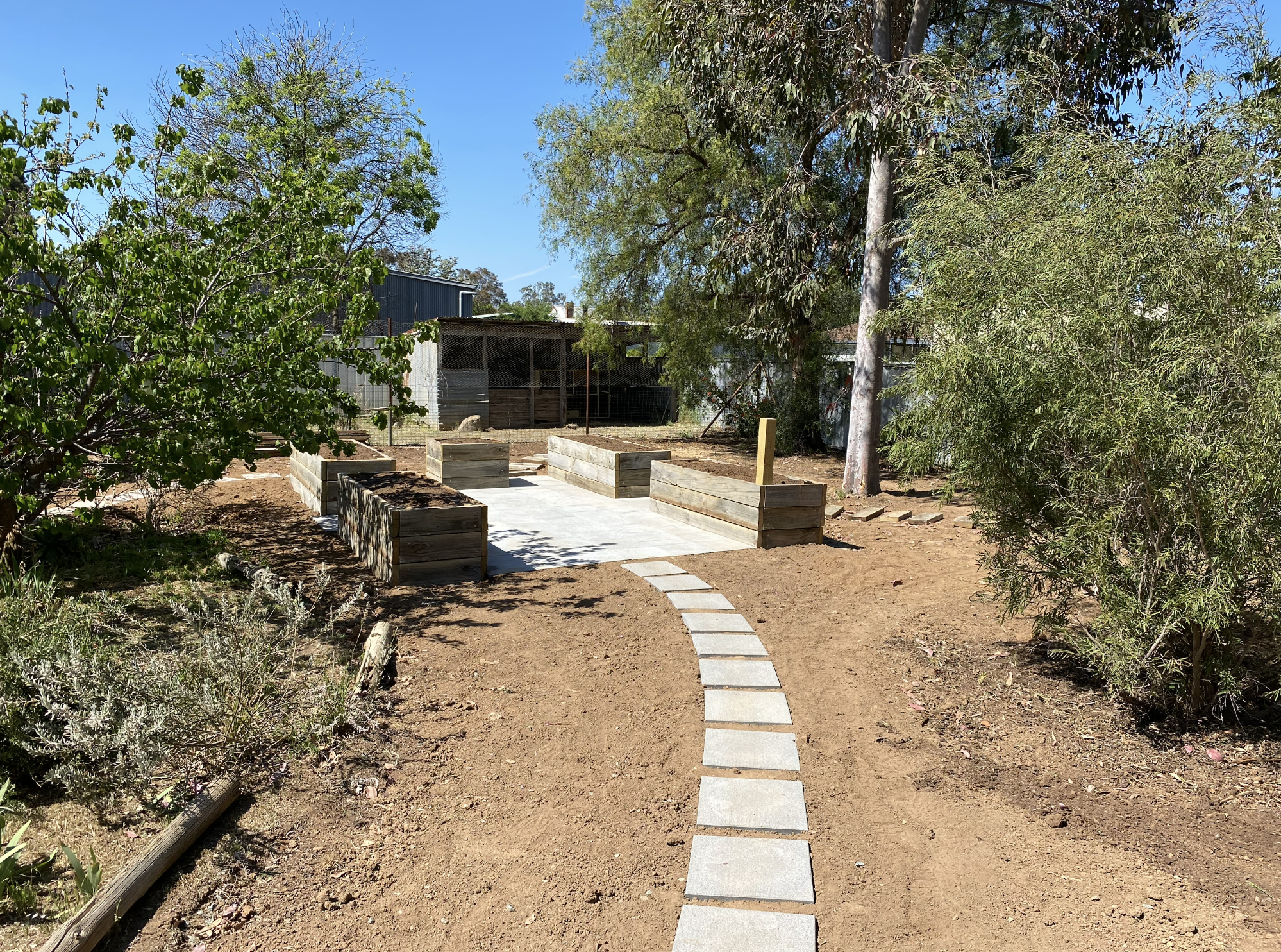 Raised garden beds installed in Bendigo with skid steer earthworks and site preparation