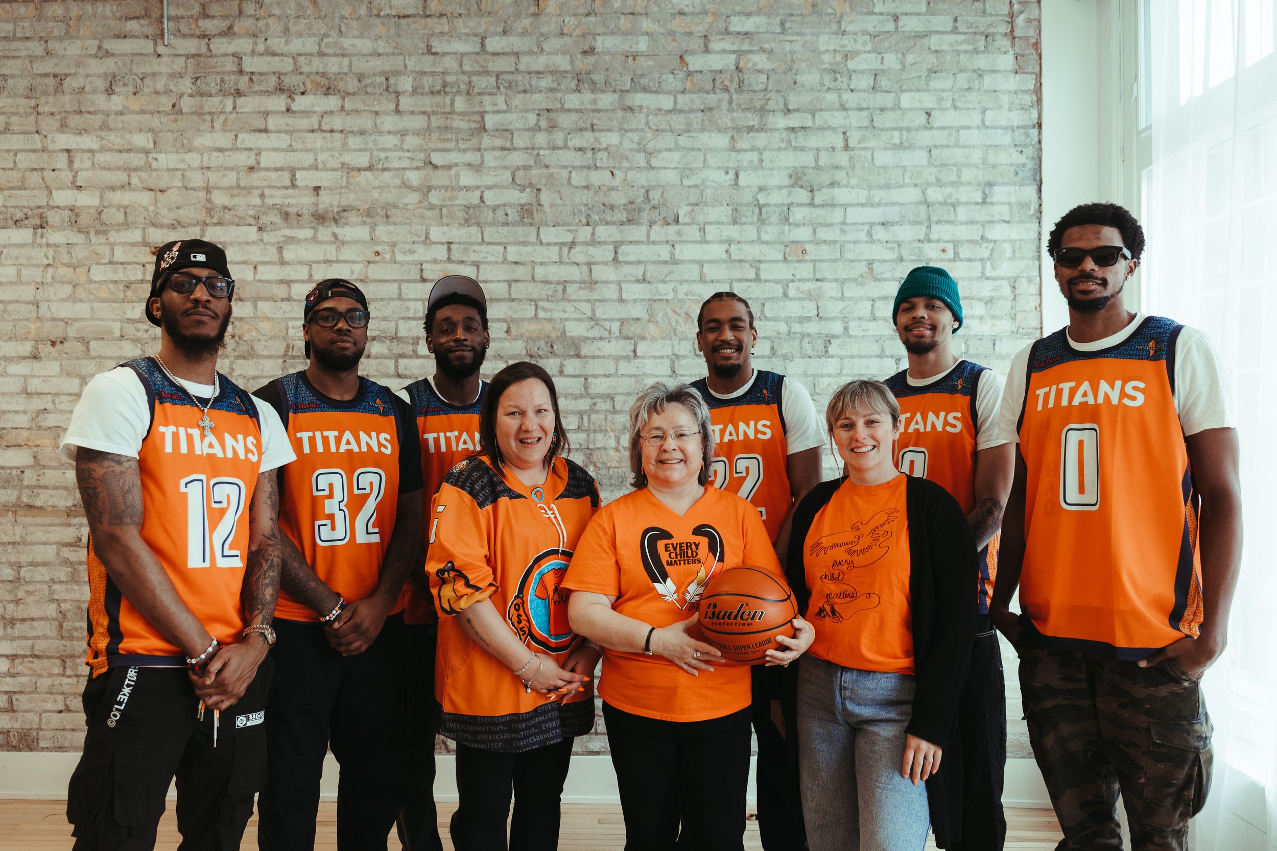 The KW Titans players with Sheena and Phyllis Webstad at the West Haus Studio in Downtown Kitchener owned by Stephanie Banks.