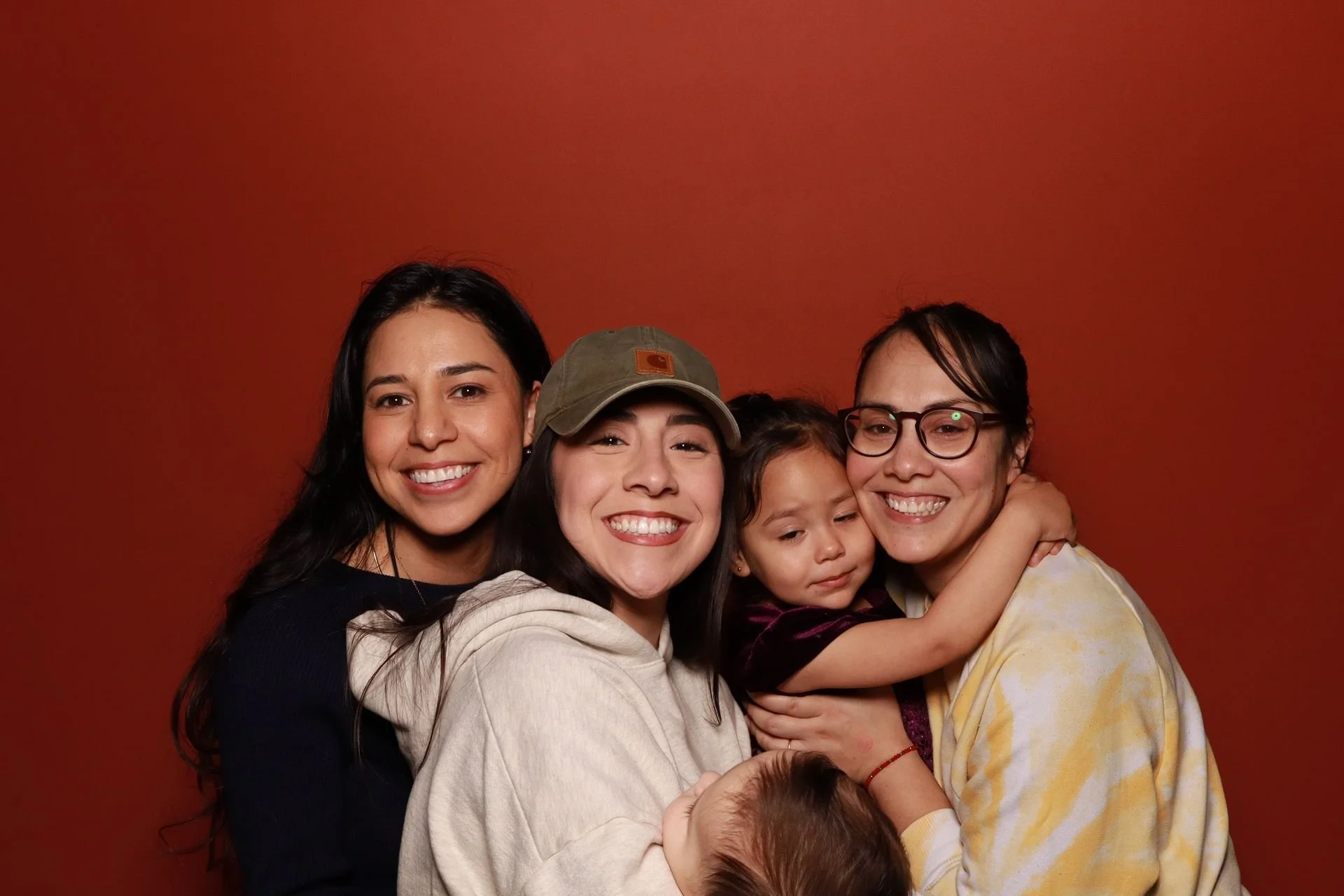 Sisters posing for photo booth at a tradeshow in Portland.