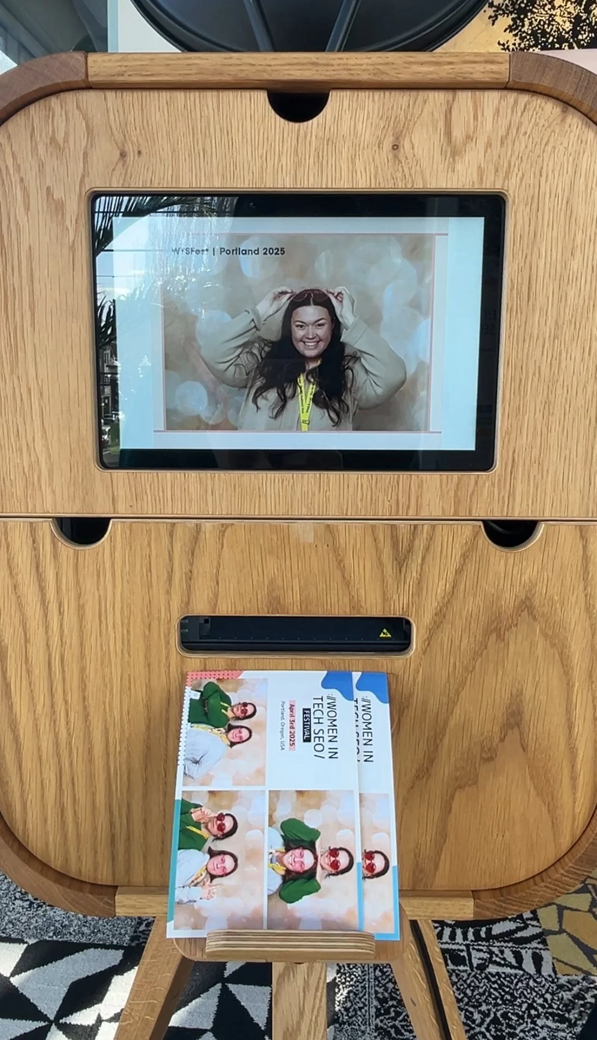 Rear photo booth screen showing printed image at corporate event at a Portland event 