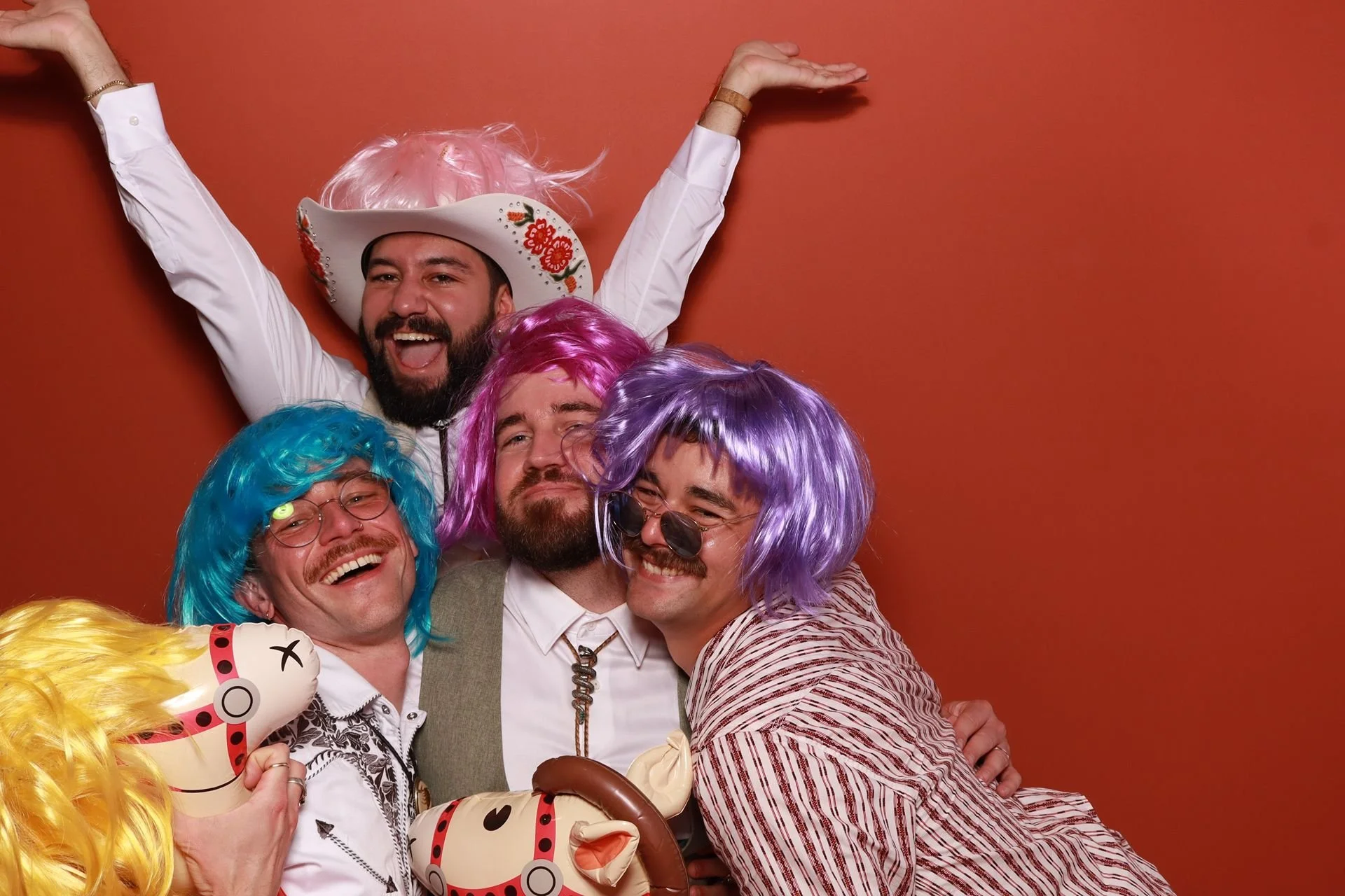 Grooms and guests posing in photobooth at Evergreen Events McMinnville.