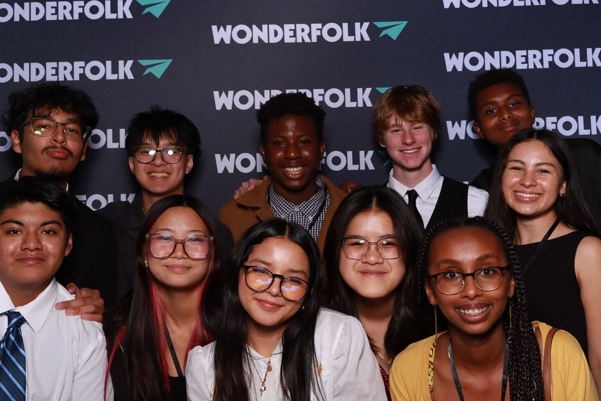 Gala attendees smiling in the photo booth at Jupiter Next Gala in Portland.