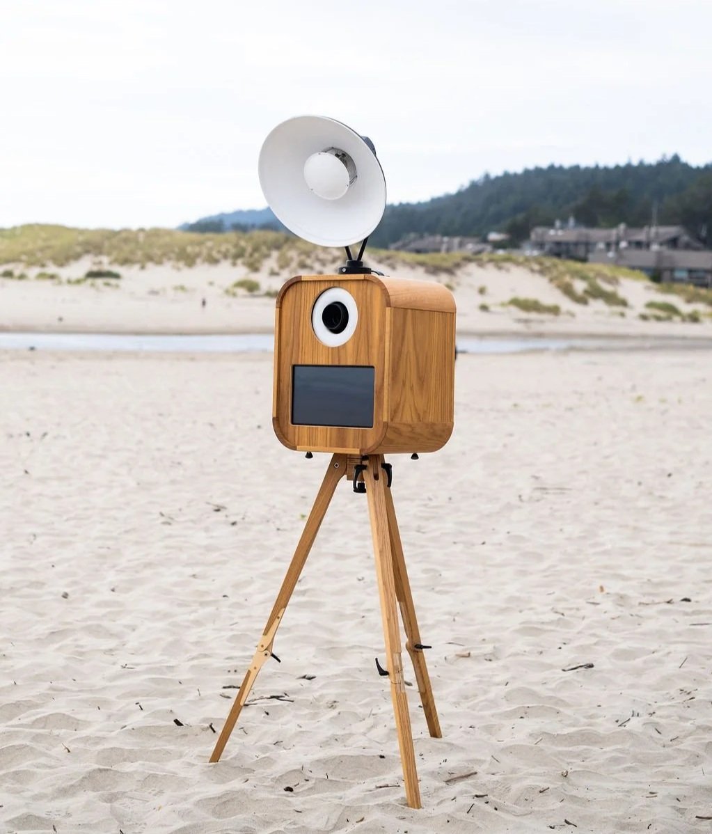 Vintage photo booth on the sand at the oregon coast.