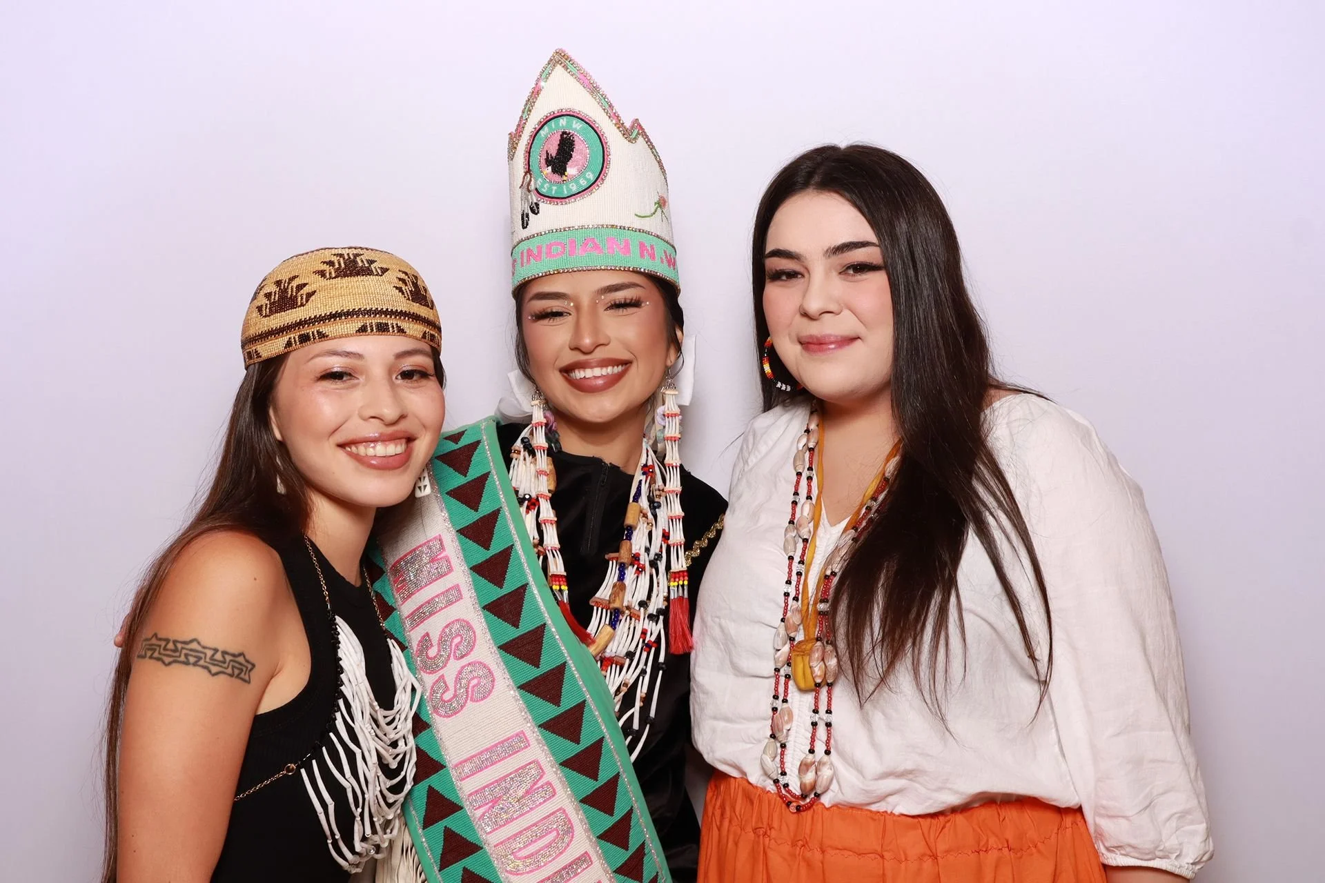 Friends posing for photo booth at Portland Luncheon