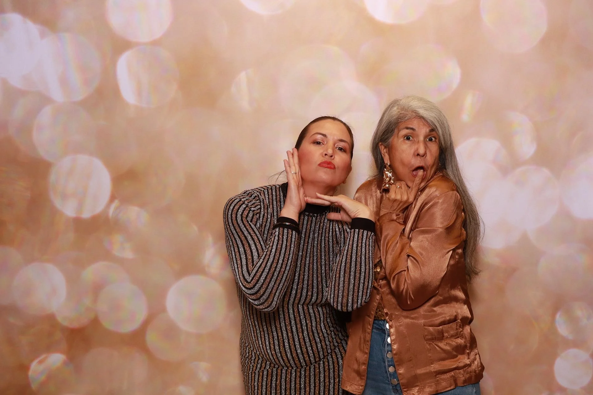 Product launch attendees posing for photo booth in Portland.