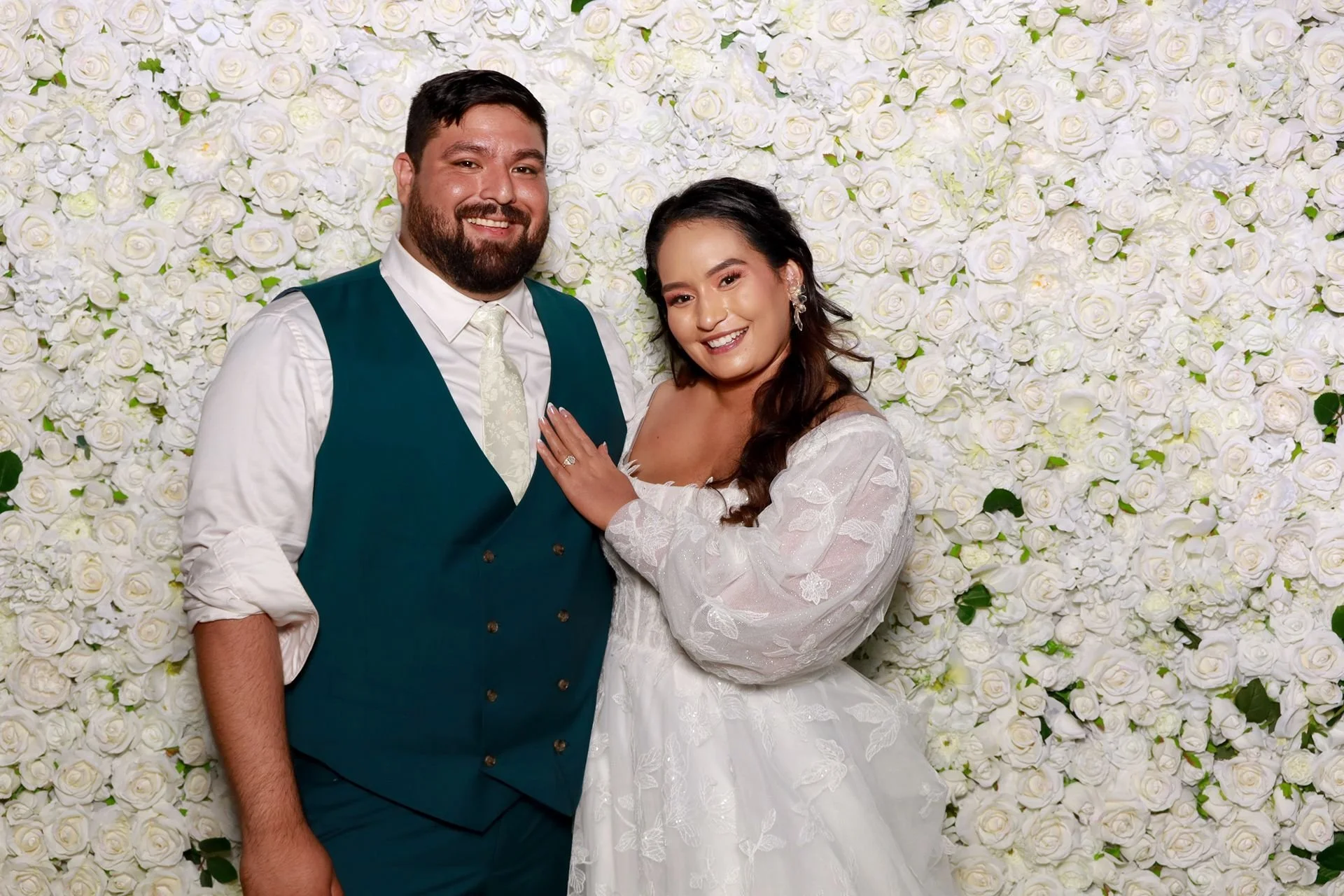 Brie and the groom posing in a photobooth Alsea Oregon.