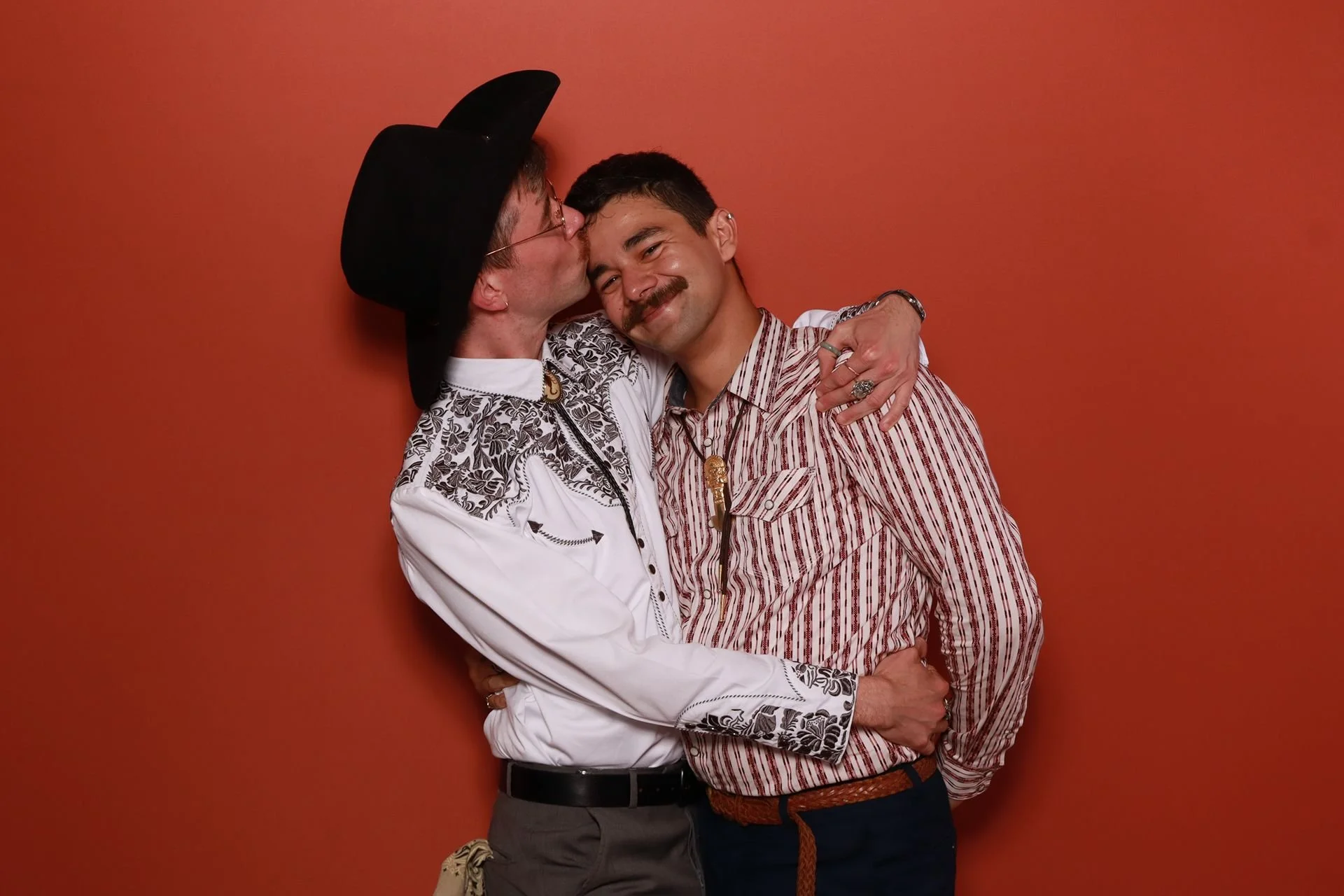 Couple kissing in photobooth at Evergreen Events McMinnville.