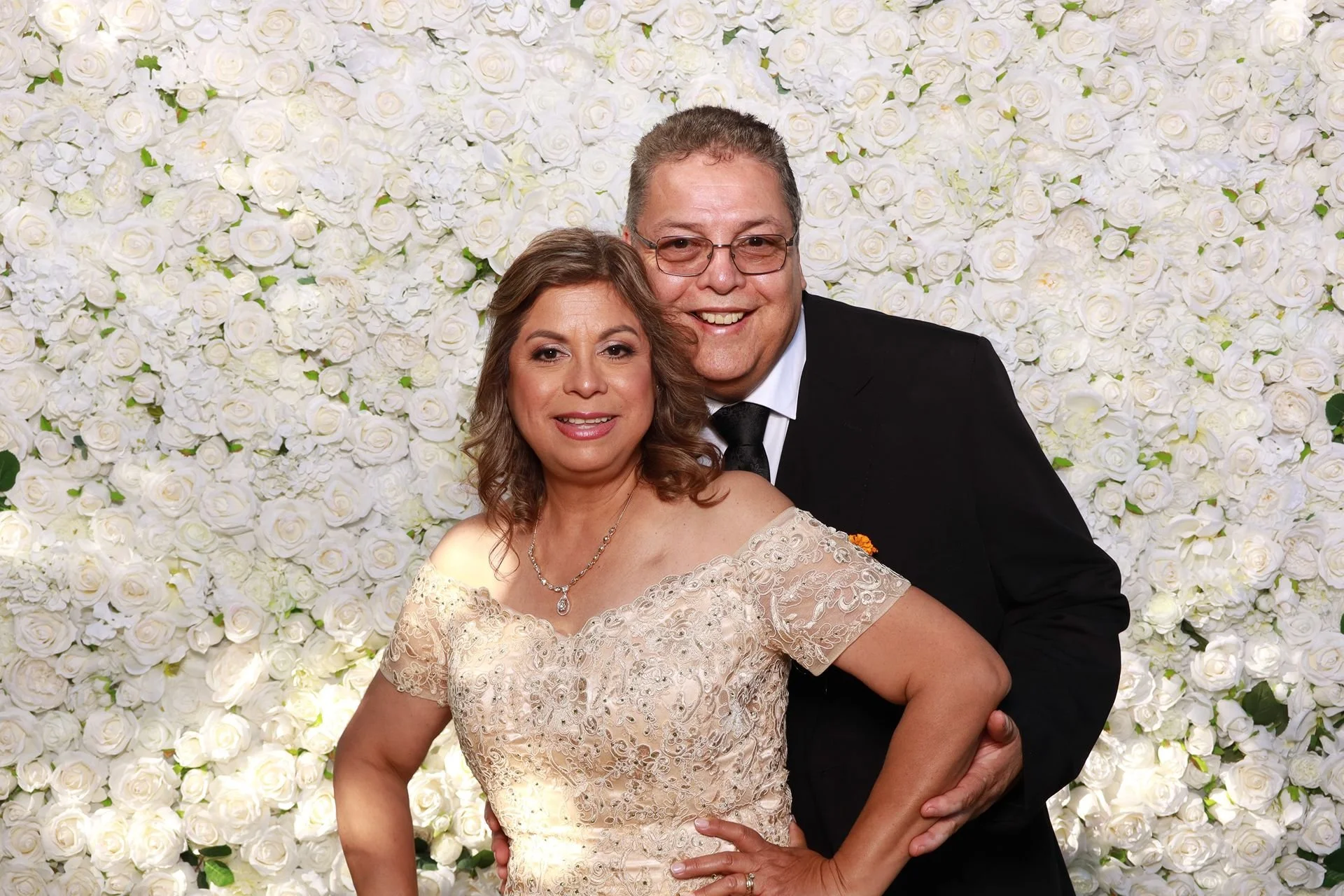 Parents of groom posing in a photobooth Alsea Oregon.