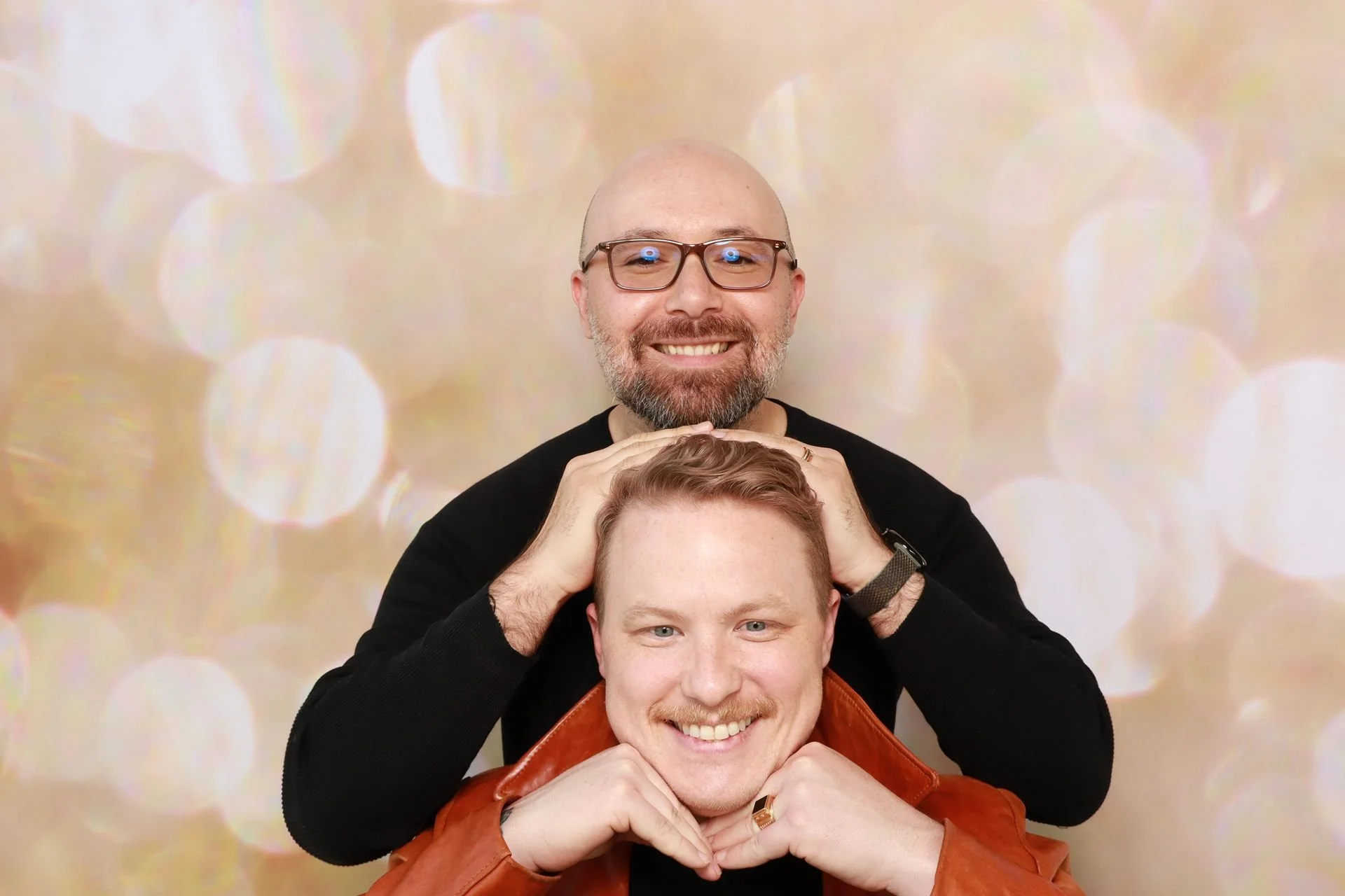 Married guests posing for photo booth at a festival in Portland.