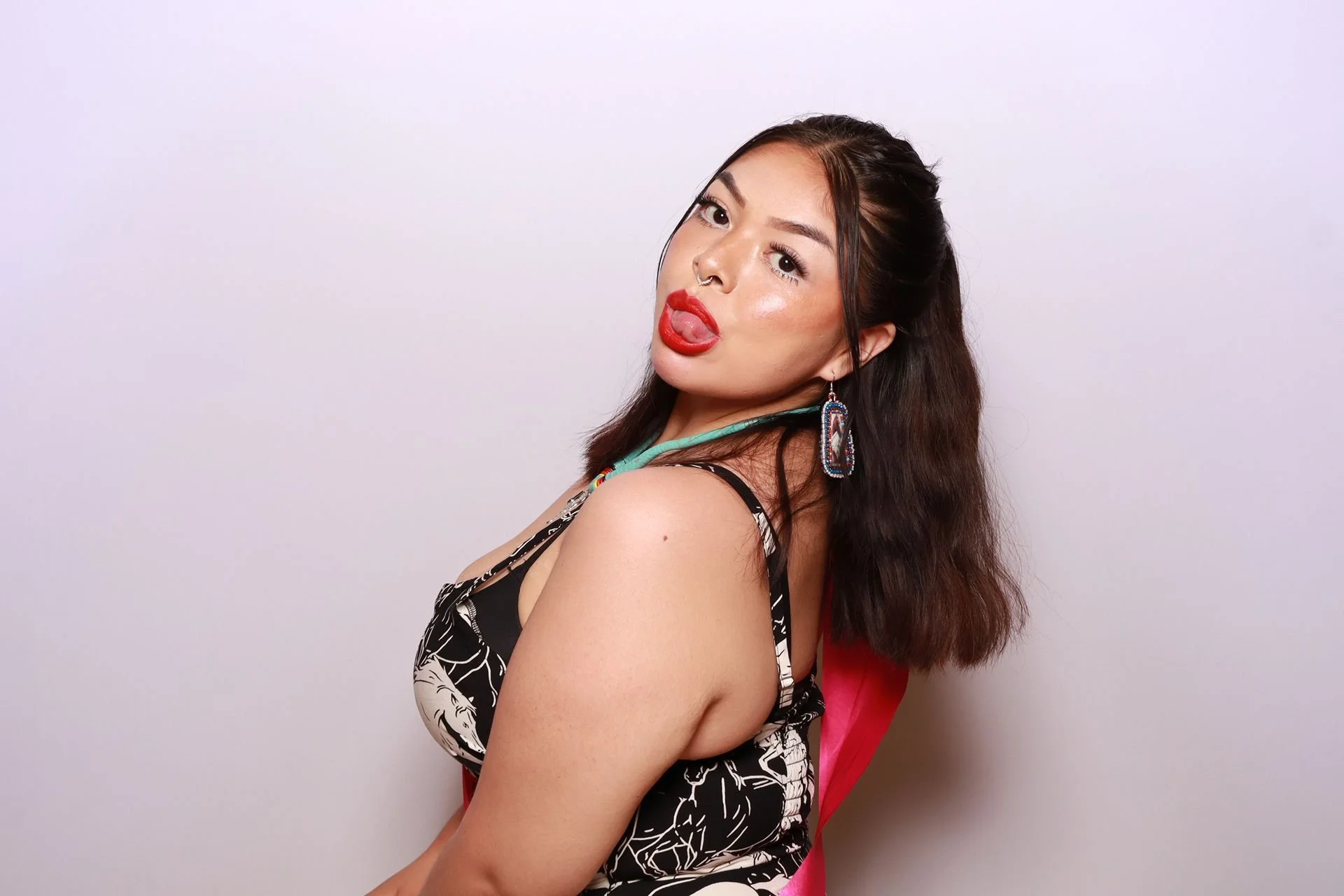 Guest posing for photo booth at Portland Luncheon
