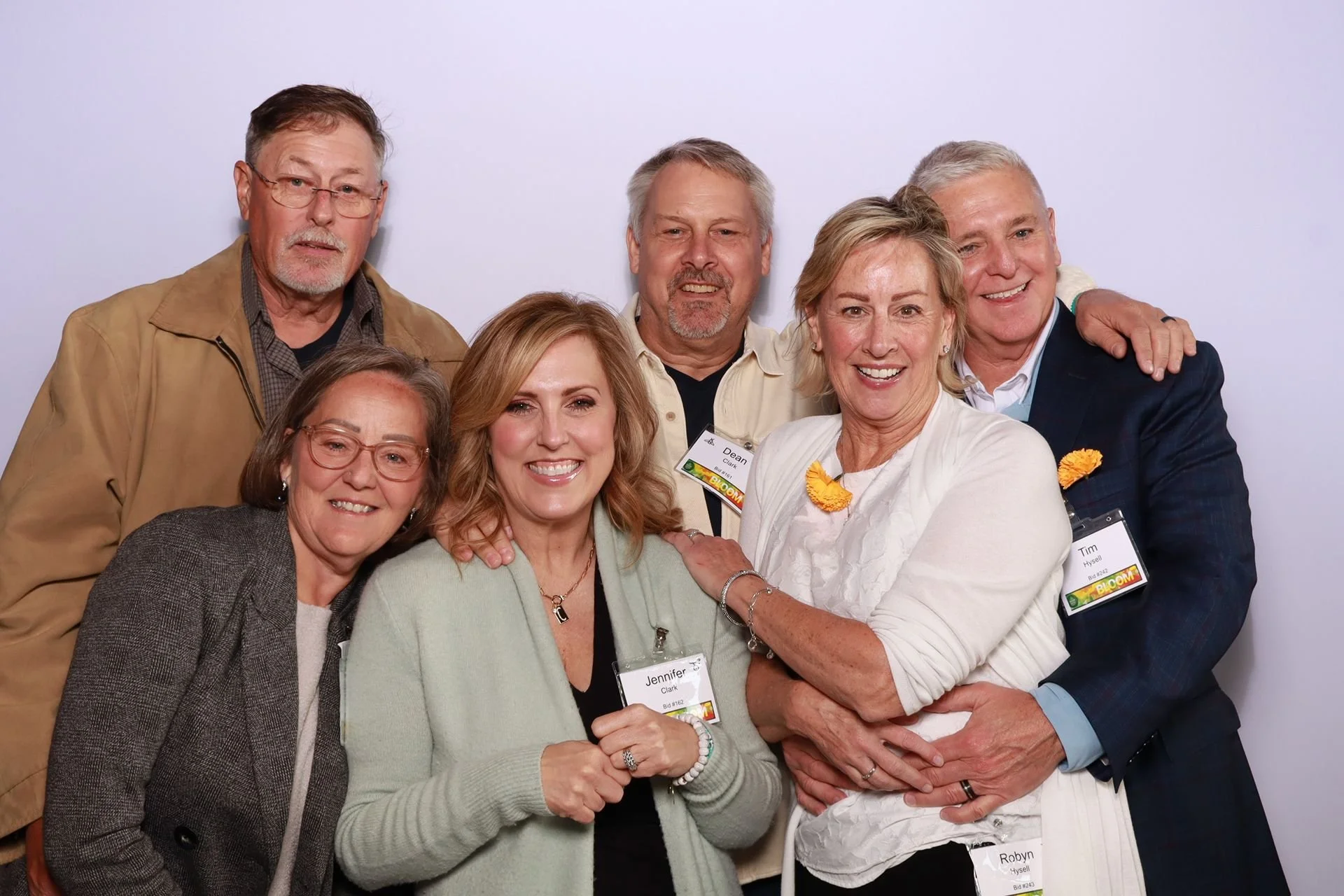 Friends posing in a photo booth at a gala in Portland Oregon.