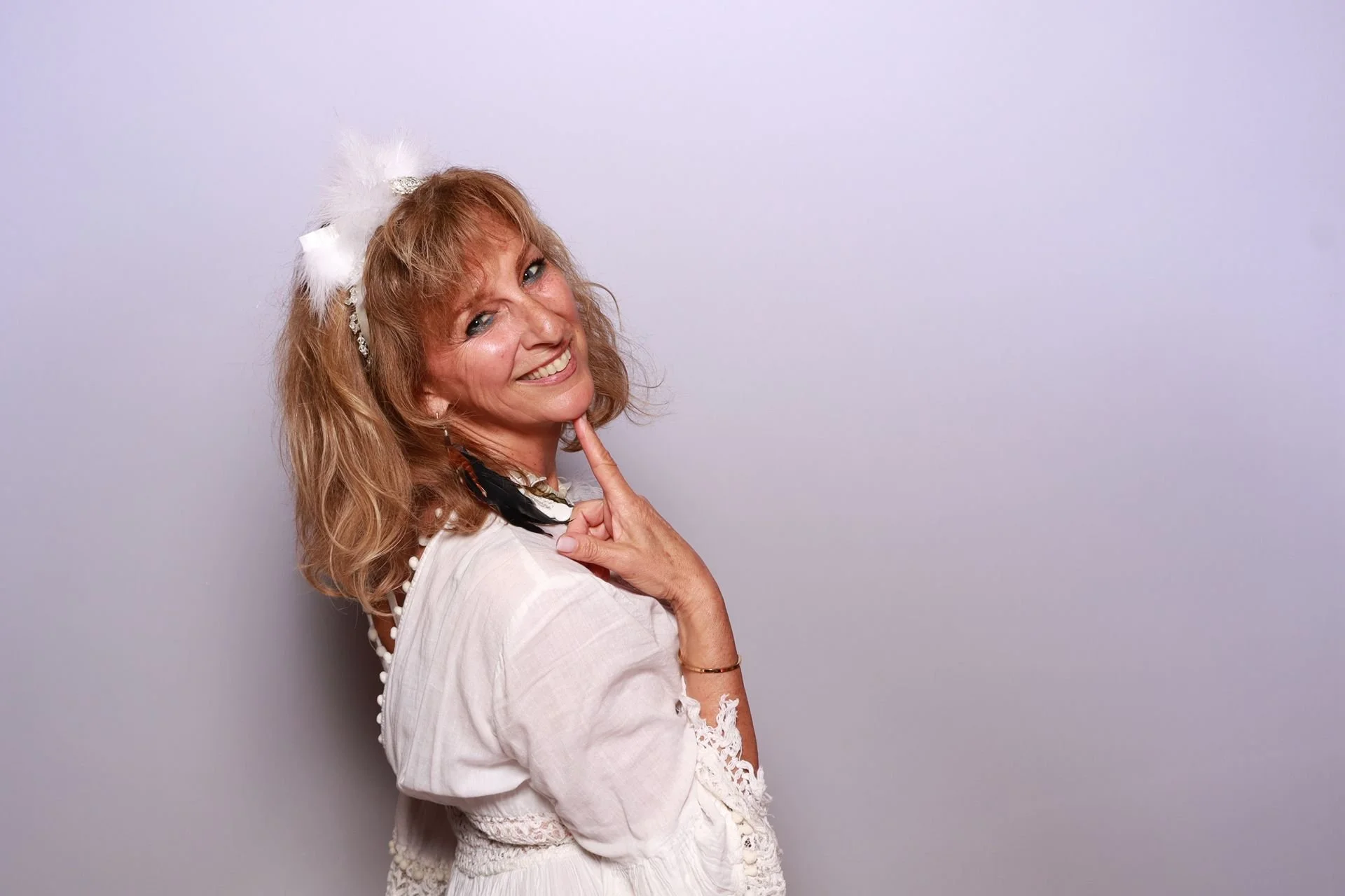 Nonprofit gala guest enjoying photo booth moments in Portland venue.