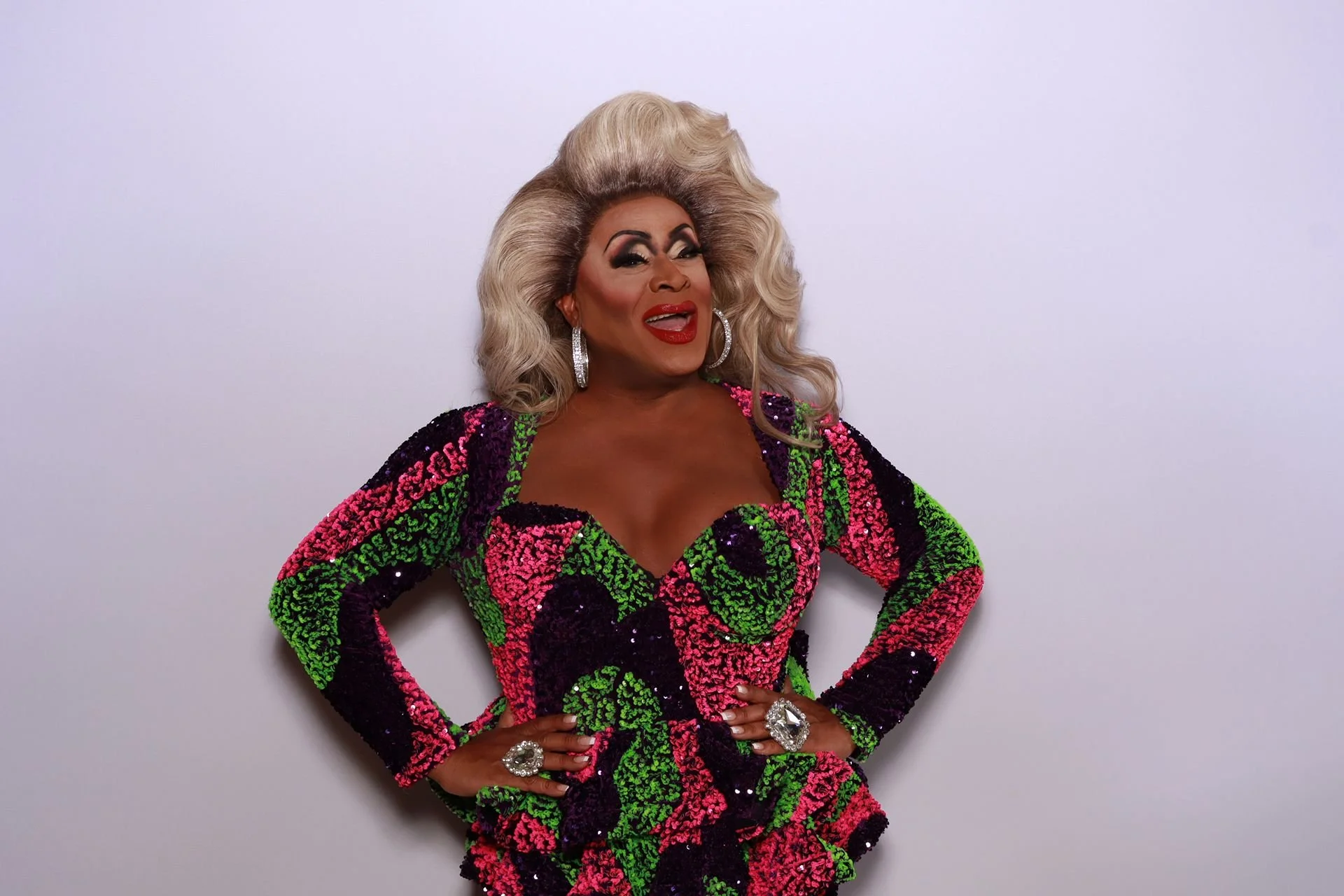 Drag queen Poison waters posing for photo booth in Portland Gala.