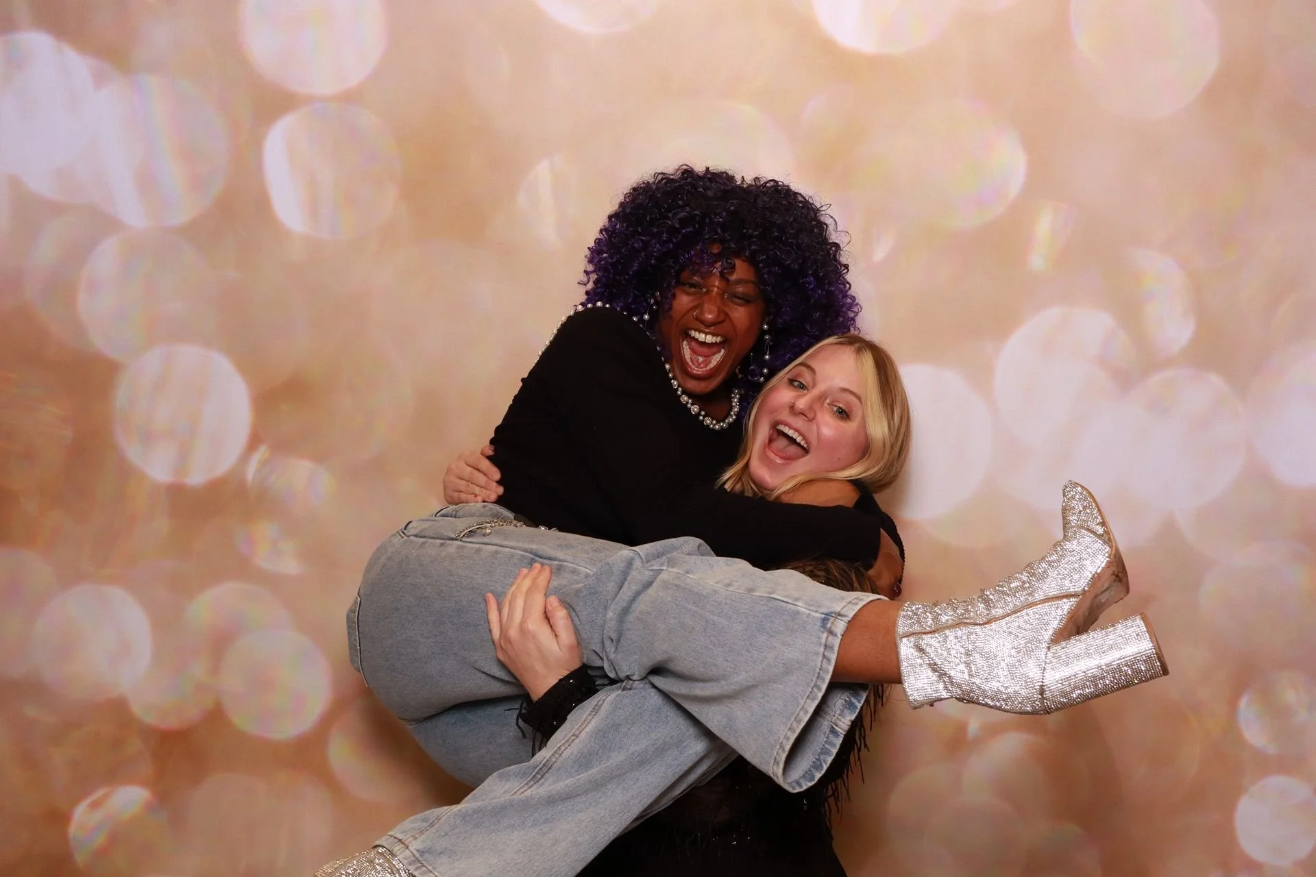 Friends posing for photo booth at a product launch in Portland.