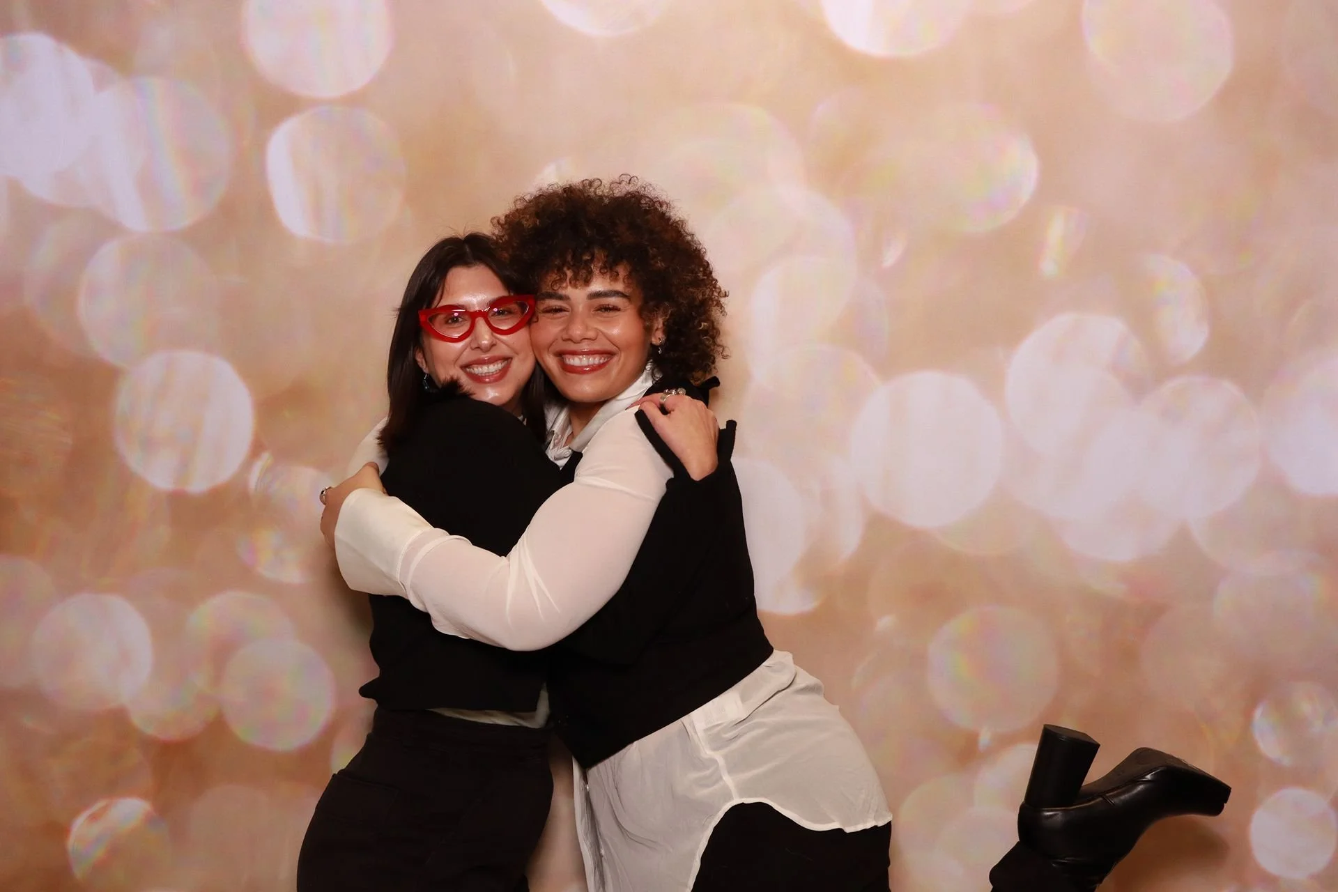 Guests celebrating in a photo booth at a product launch in Portland.