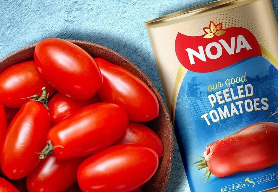 Bowl of fresh red Roma tomatoes next to can of Nova peeled tomatoes on blue surface – imported canned foods supplied by Jetha Australian food importers
