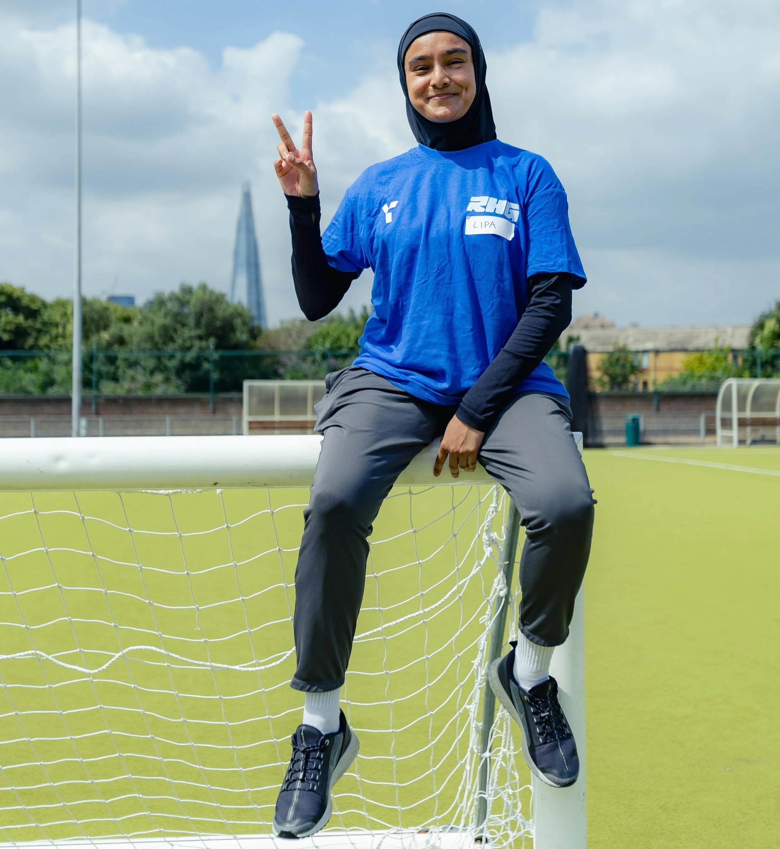 Lipa Nessa smiling outdoors, grassroots football coach and sports activist promoting inclusion and diversity.