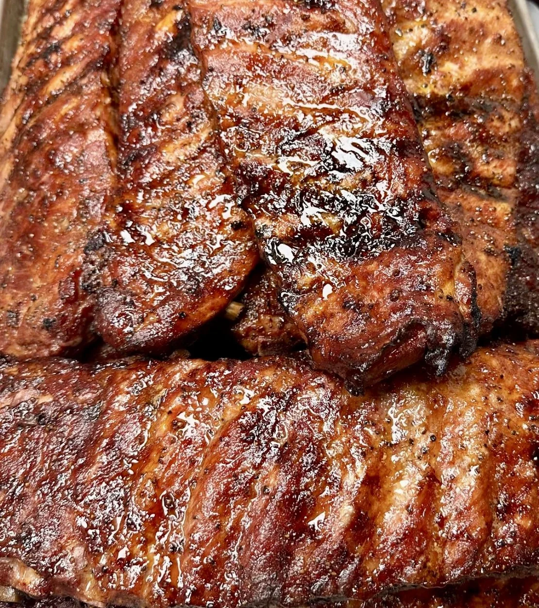 Close-up of florida top rated smoked ribs with a dry rub seasoning.