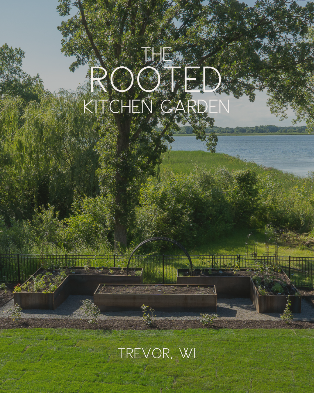 The Rooted Kitchen Garden in Trevor, Wisconsin, with custom corten steel raised beds, black trellises, and a lakeview setting surrounded by mature trees.