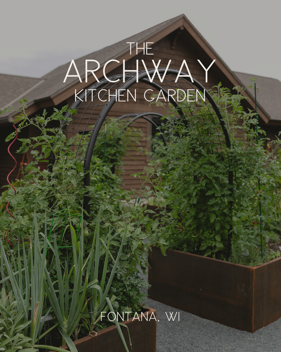 The Archway Kitchen Garden in Fontana, Wisconsin, with corten steel raised beds, abundant vegetables, and custom black arch trellises.