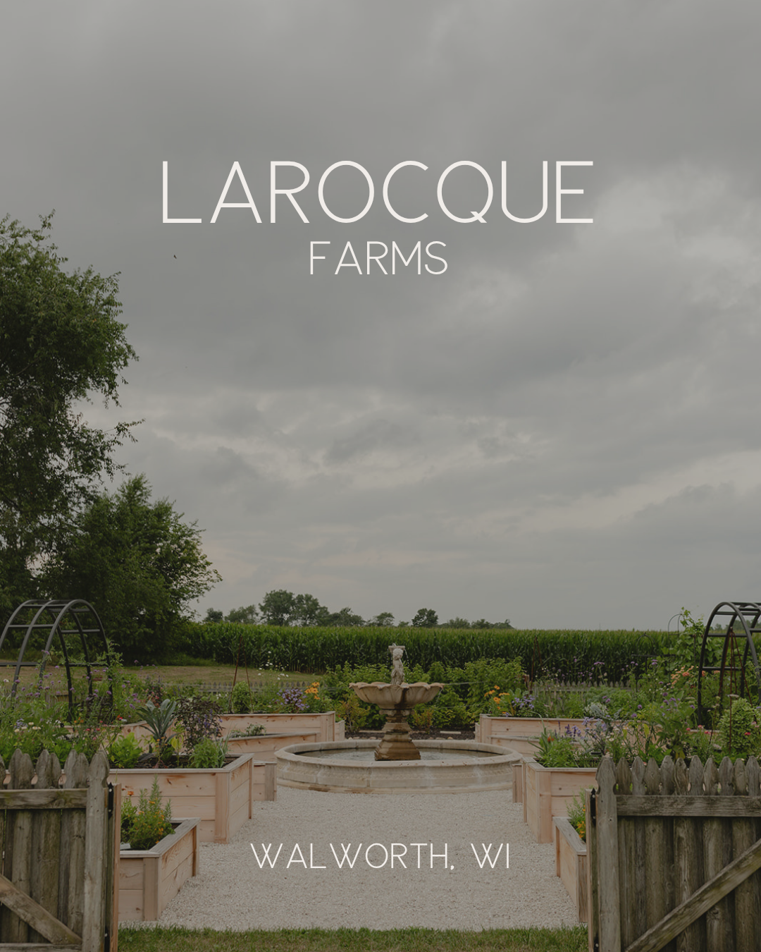 LaRocque Farms wedding venue kitchen garden in Walworth, Wisconsin, with custom cedar raised beds, a central fountain, arch trellises, and formal potager design.