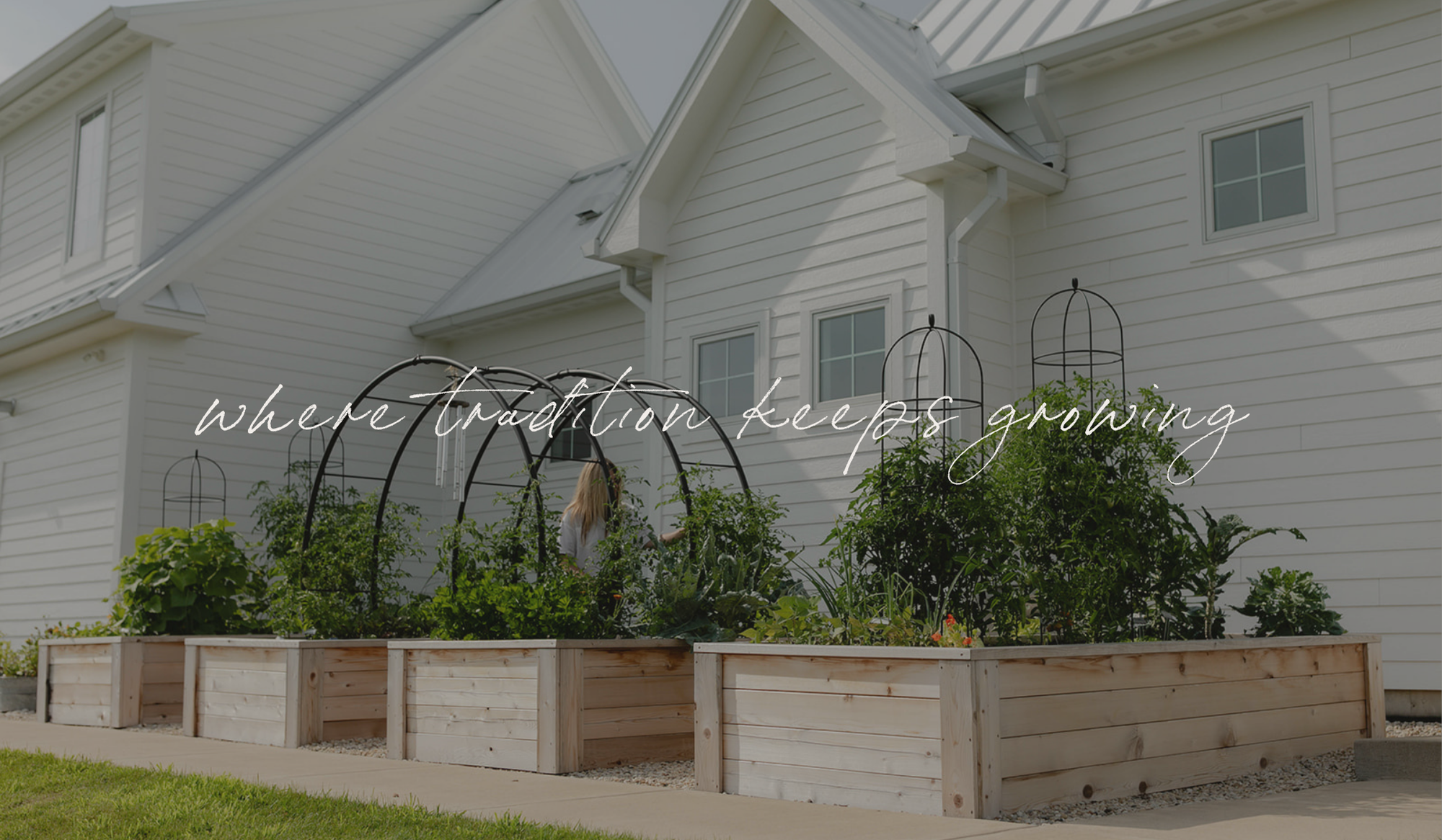 The Heirloom Garden with cedar raised beds and custom trellises, where tradition keeps growing.
