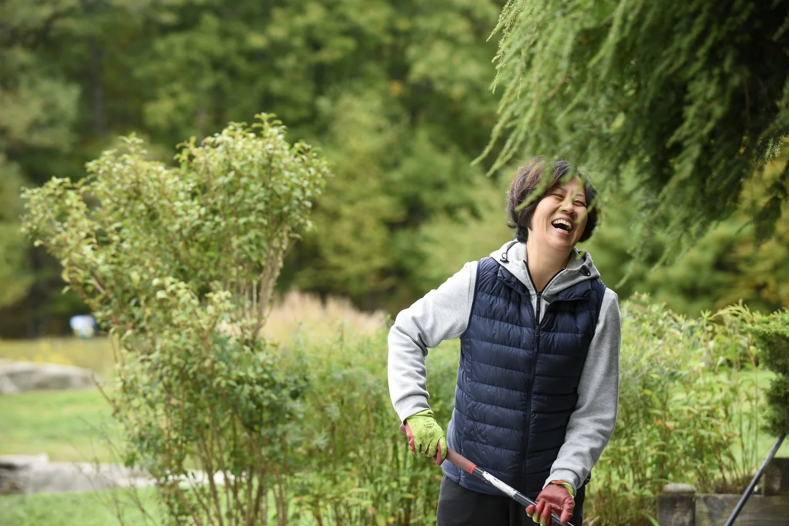 Woman gardening outside smiling